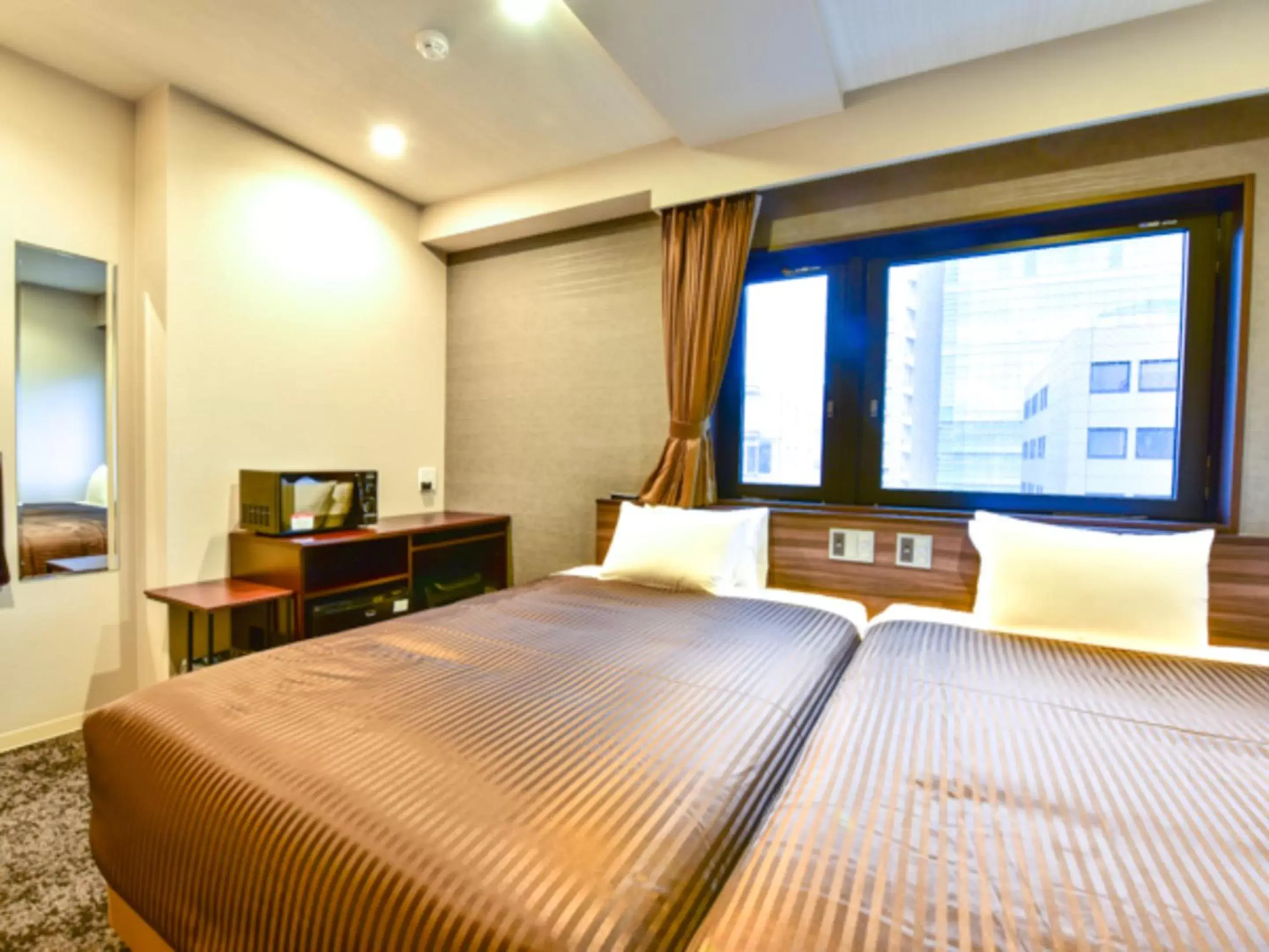 Bed in HOTEL LiVEMAX Fukuoka Tenjin West