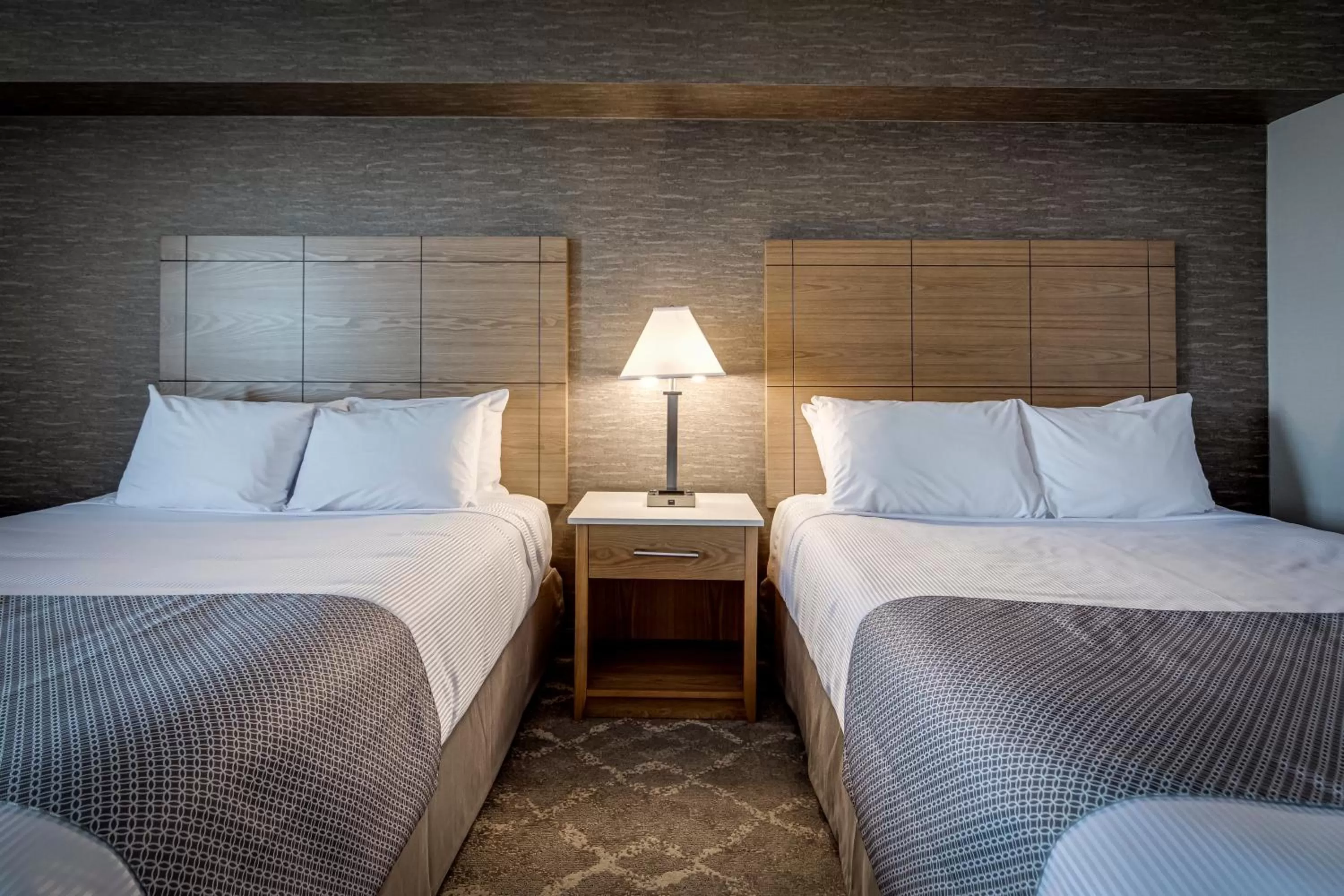 Bed in Monte Carlo Inn Vaughan Suites