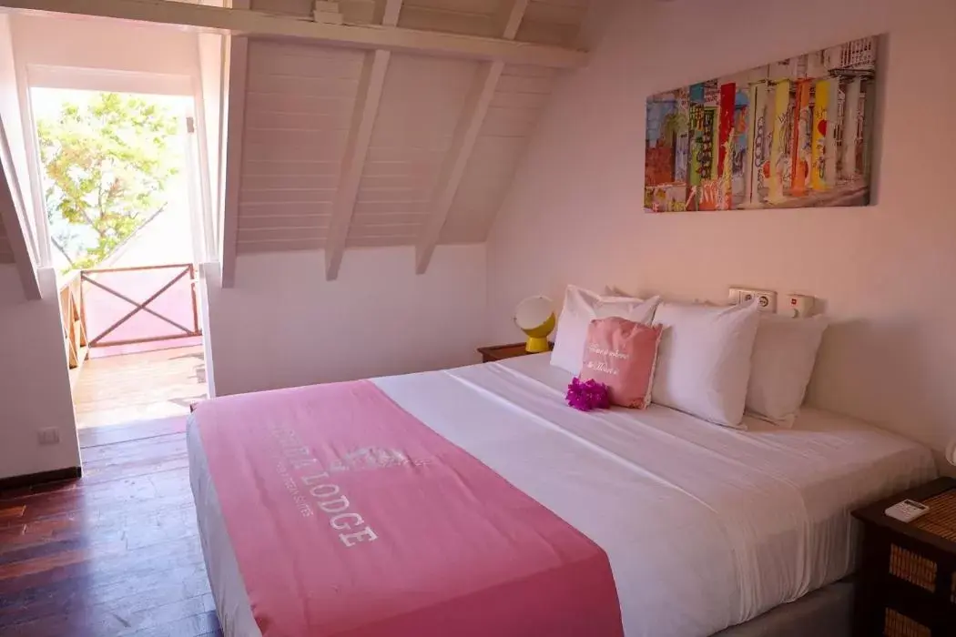 Bed in Scuba Lodge & Suites