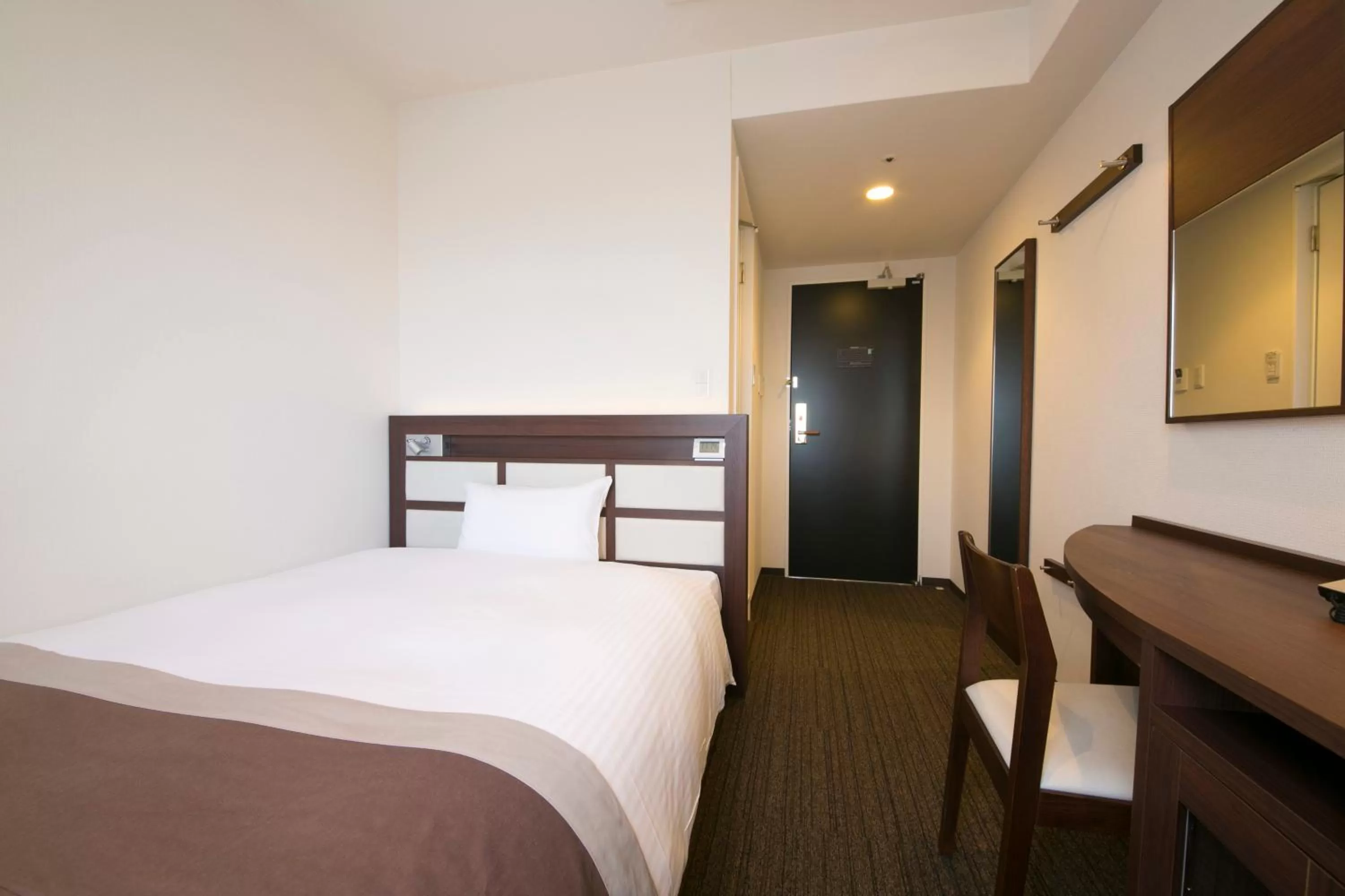 Bed in Urban Hotel Minami Kusatsu