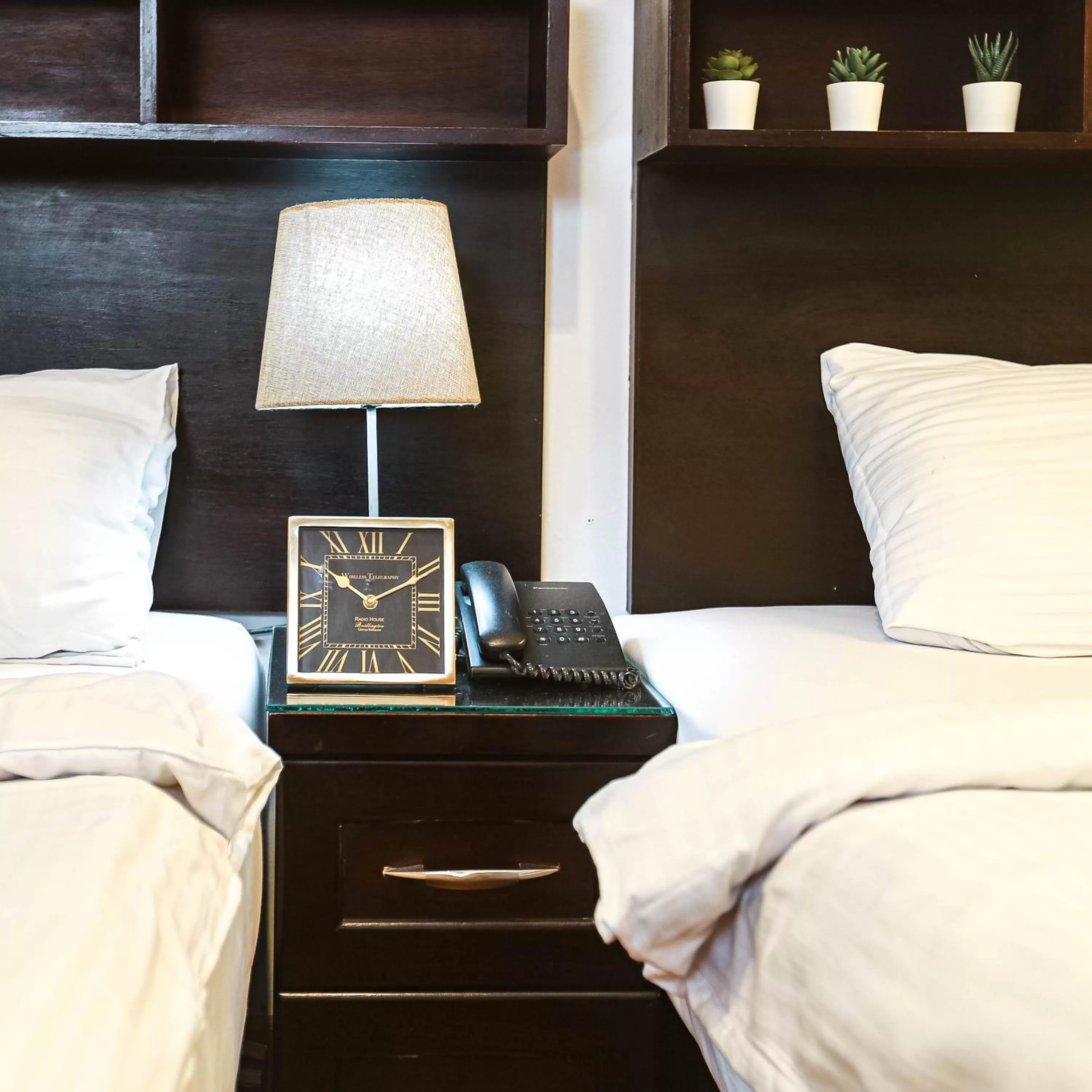 Bed in NewCity Hotel & Suites