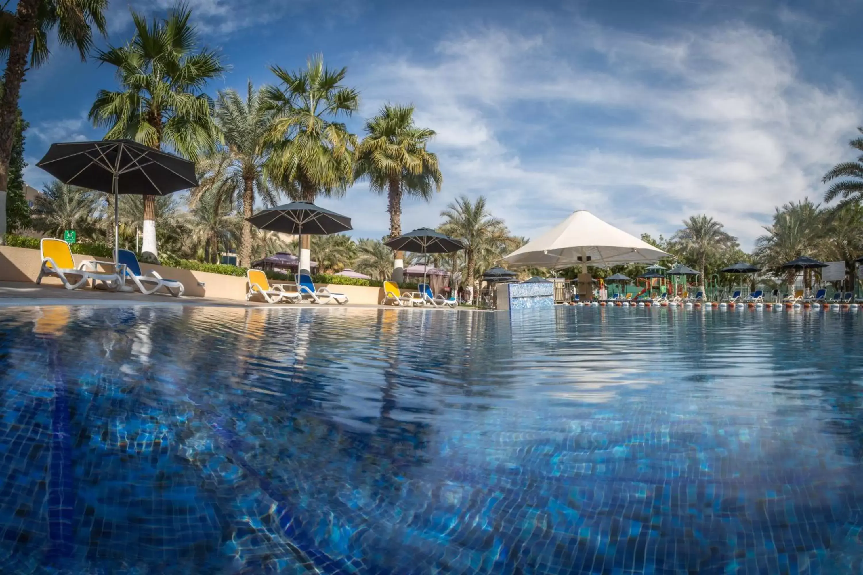 Day, Swimming Pool in Millennium Central Al Mafraq