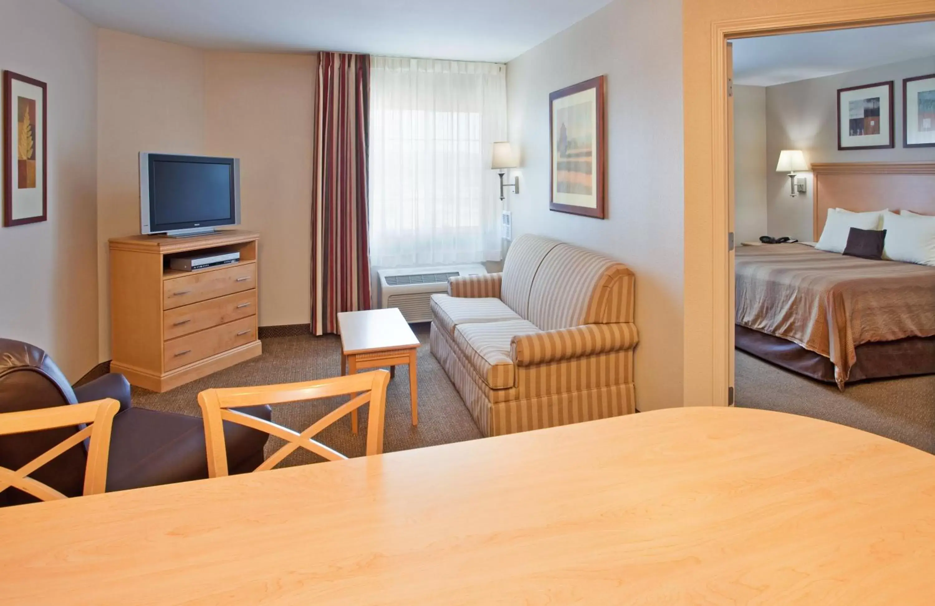 Photo of the whole room, TV/Entertainment Center in Candlewood Suites Junction City - Ft. Riley, an IHG Hotel