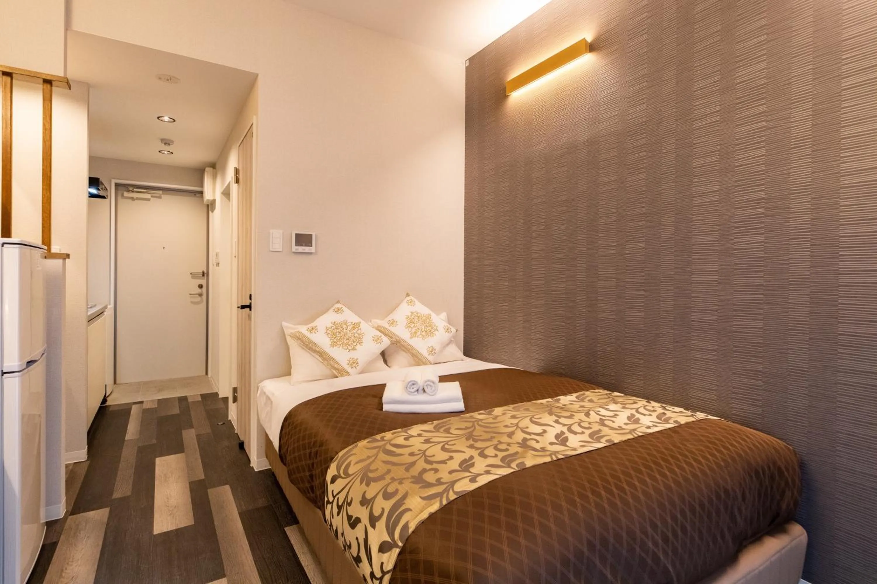 Photo of the whole room, Bed in MrKINJO in Nicas Makishi