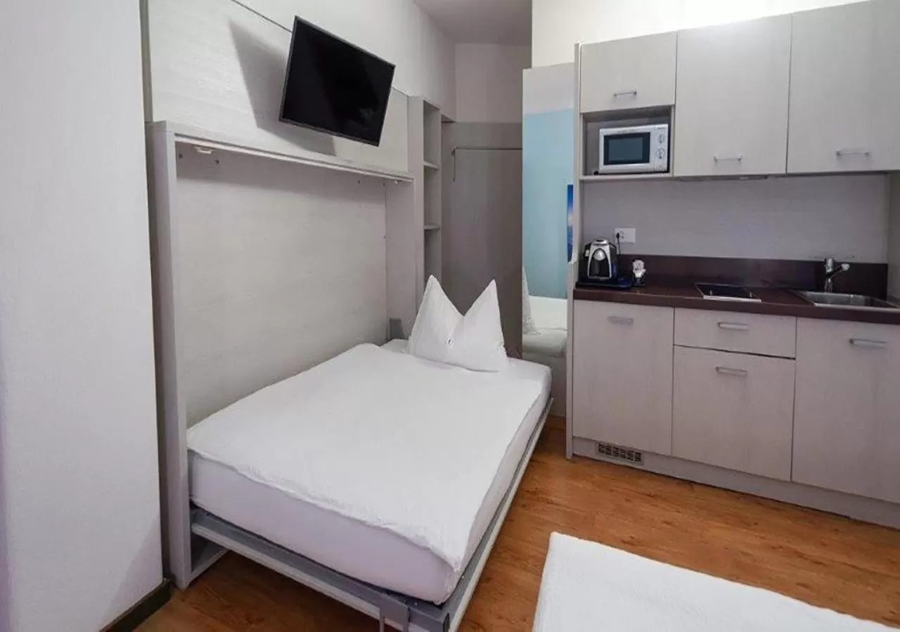 Bed in Acquarello Swiss Quality Hotel