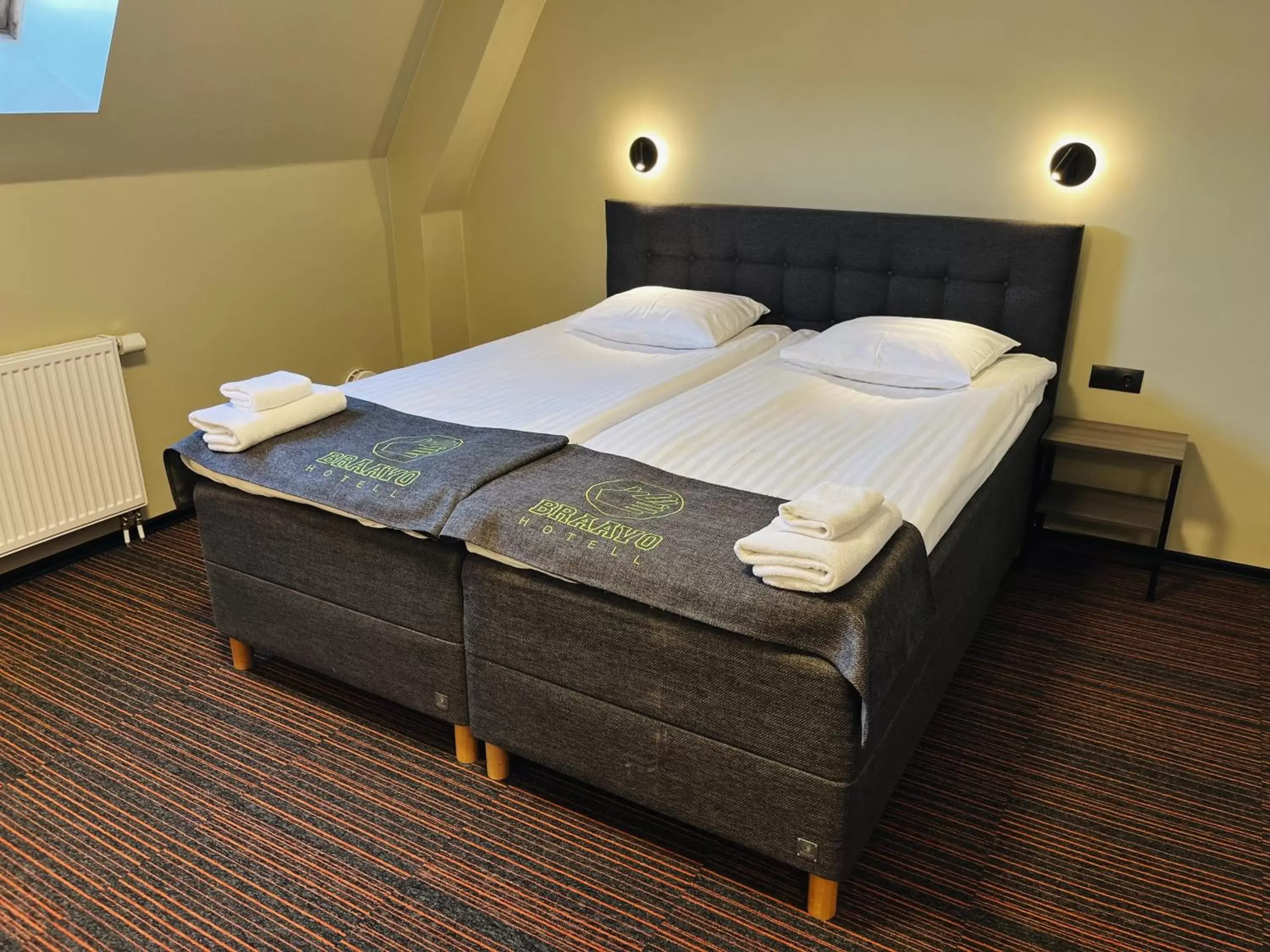 Bed in Braavo Spa Hotel