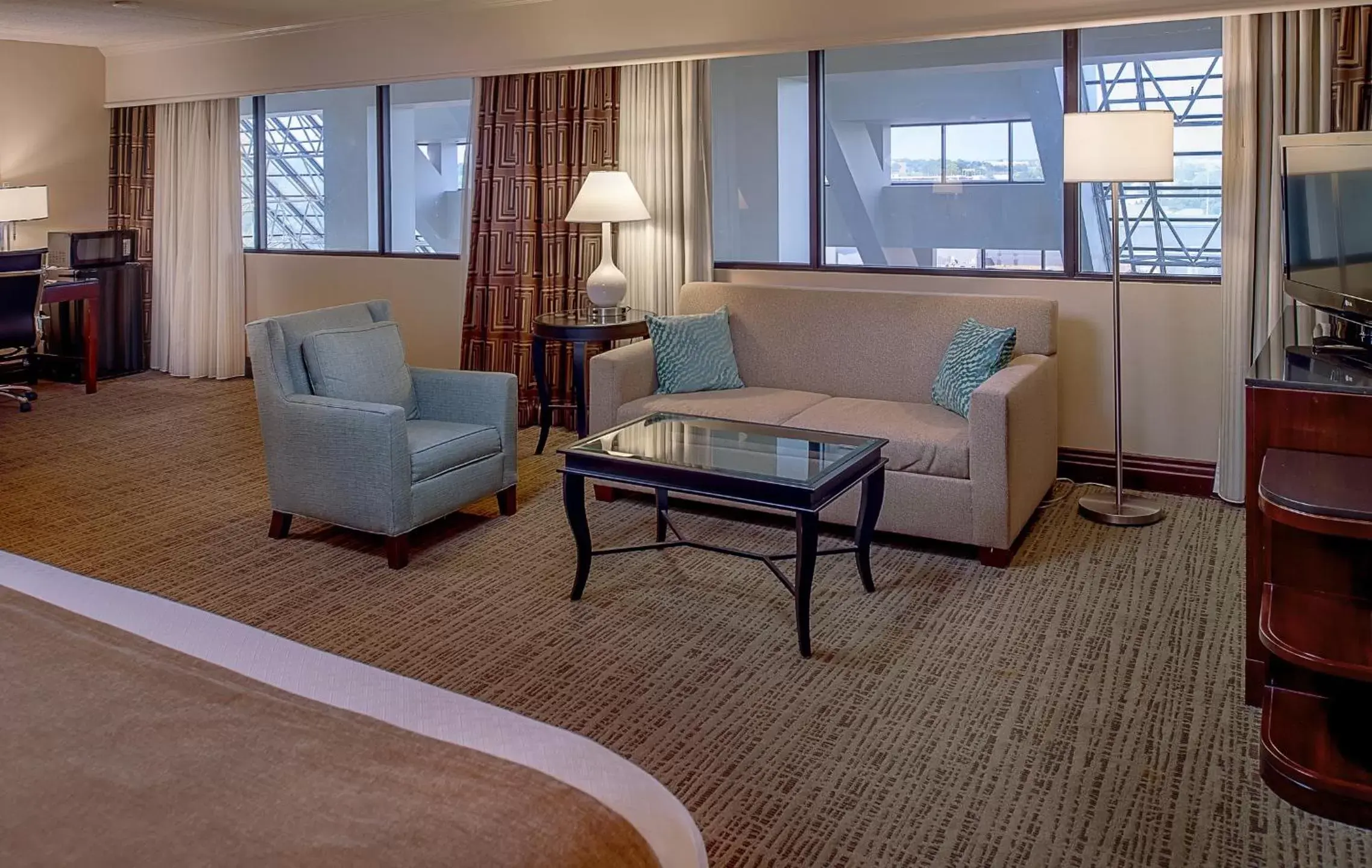 Bedroom, Seating Area in Crowne Plaza Hotel St. Louis Airport, an IHG Hotel