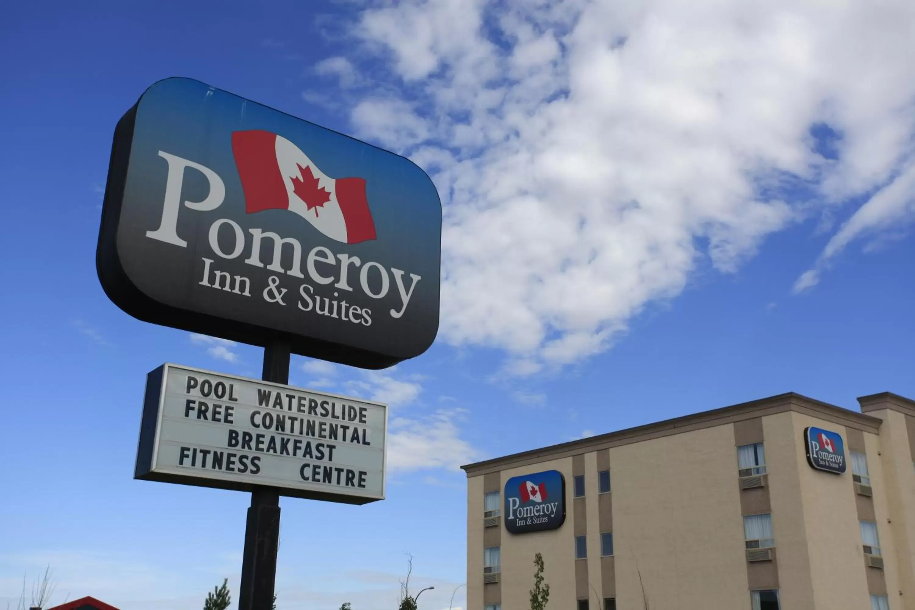 Property logo or sign in Pomeroy Inn and Suites Dawson Creek