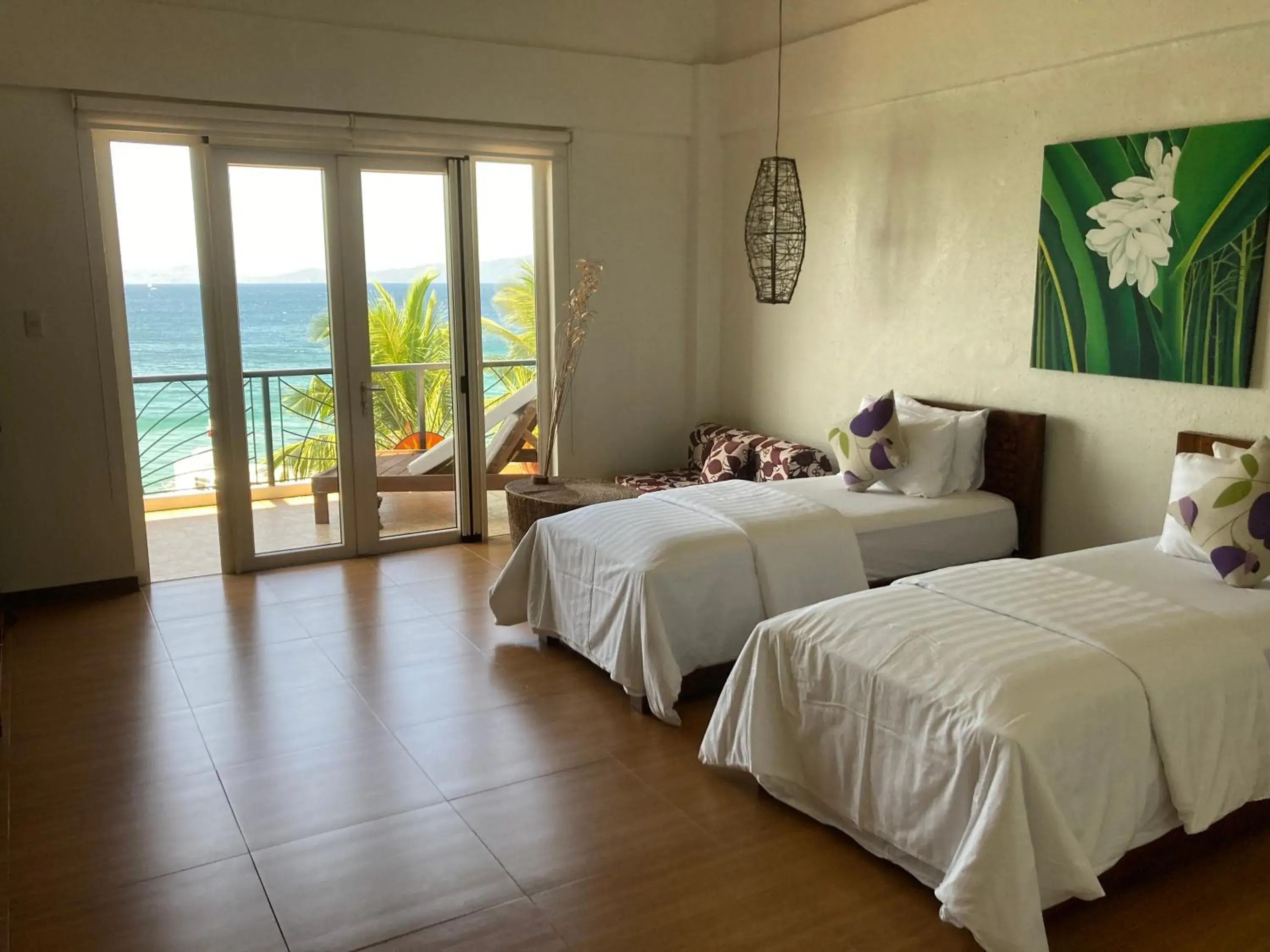 Photo of the whole room, Bed in Sunset At Aninuan Beach Resort