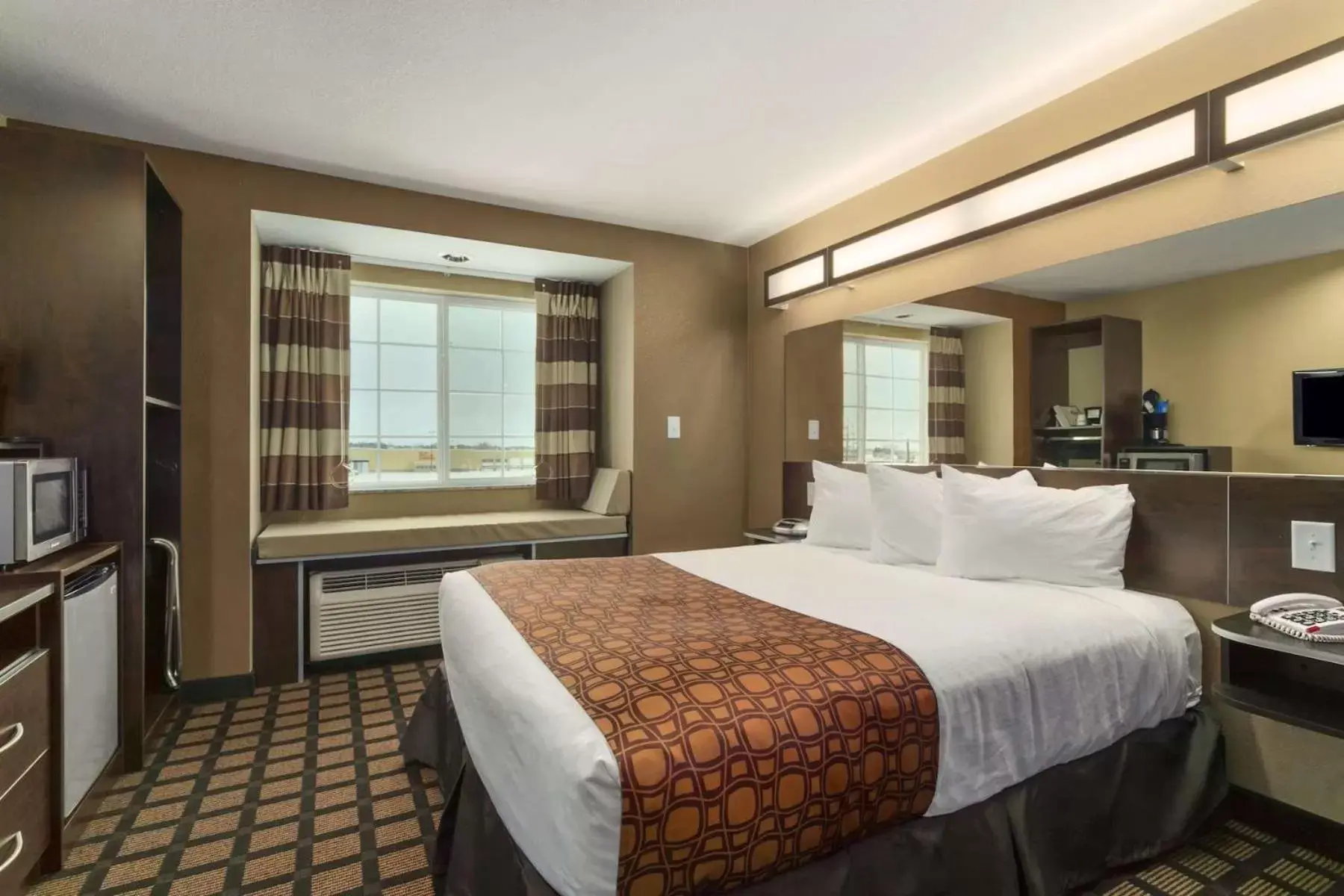 Bed in Microtel Inn & Suites by Wyndham Minot