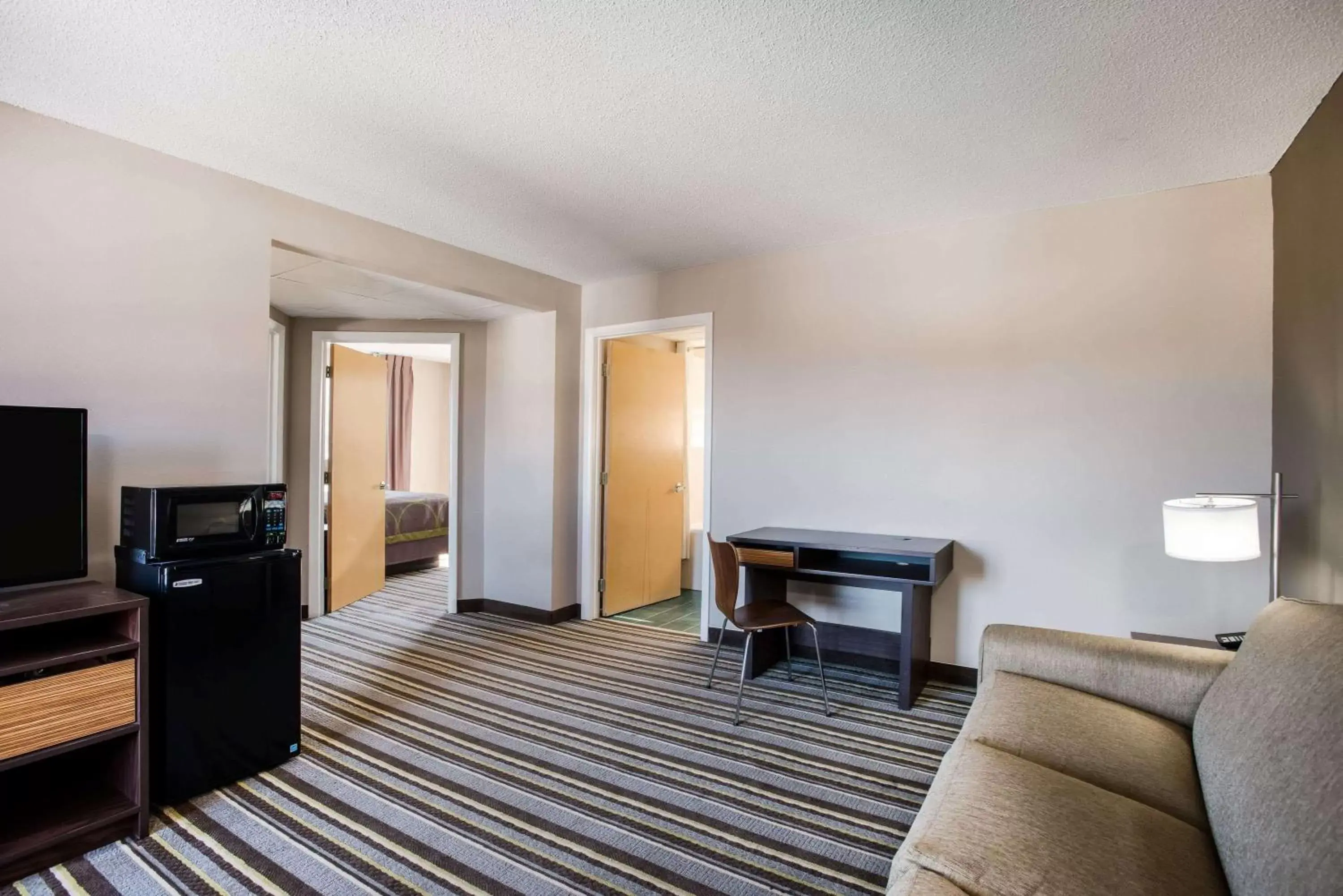 Photo of the whole room, TV/Entertainment Center in Super 8 by Wyndham Sevierville Riverside