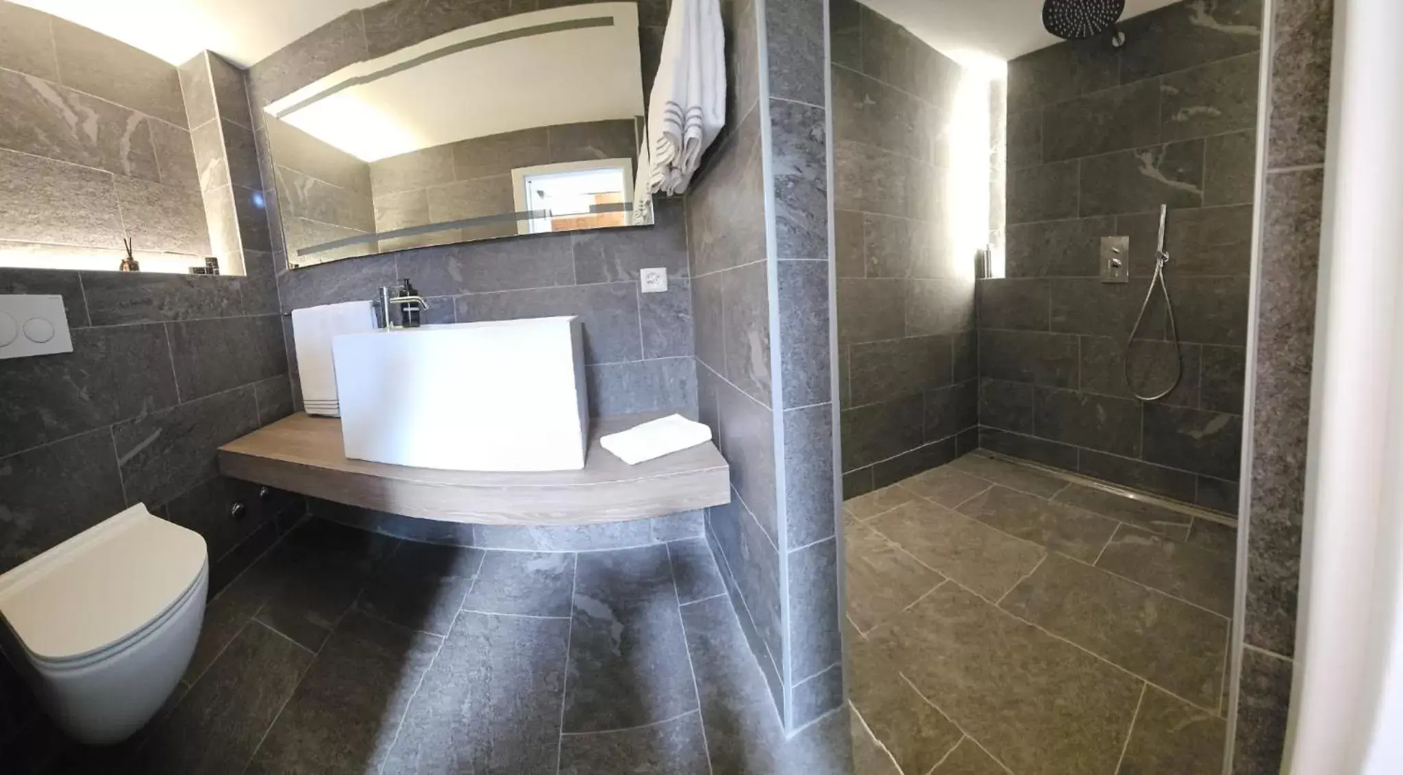 Bathroom in @ Home Hotel Locarno