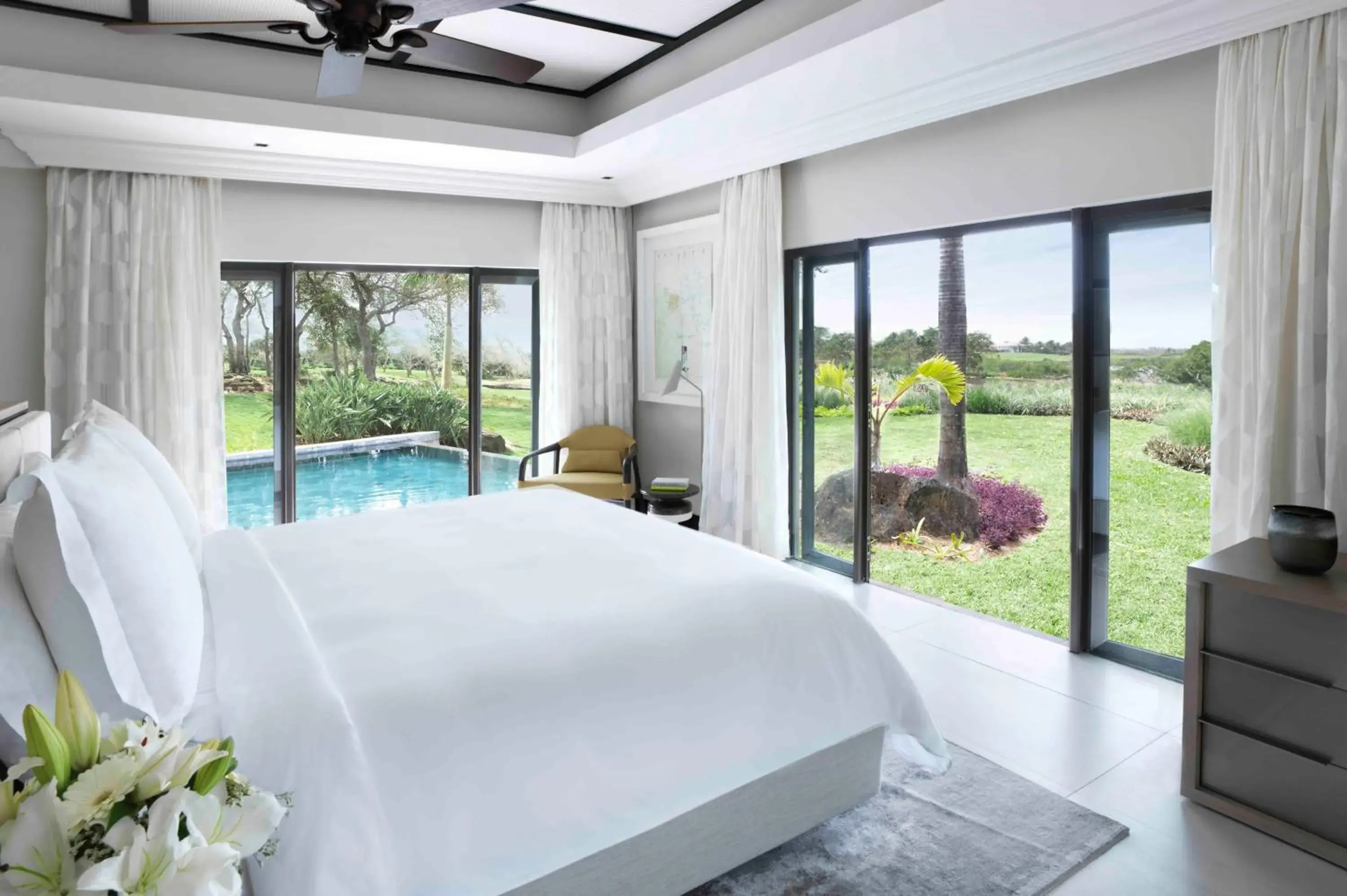 Bed, Pool View in Four Seasons Resort Mauritius at Anahita