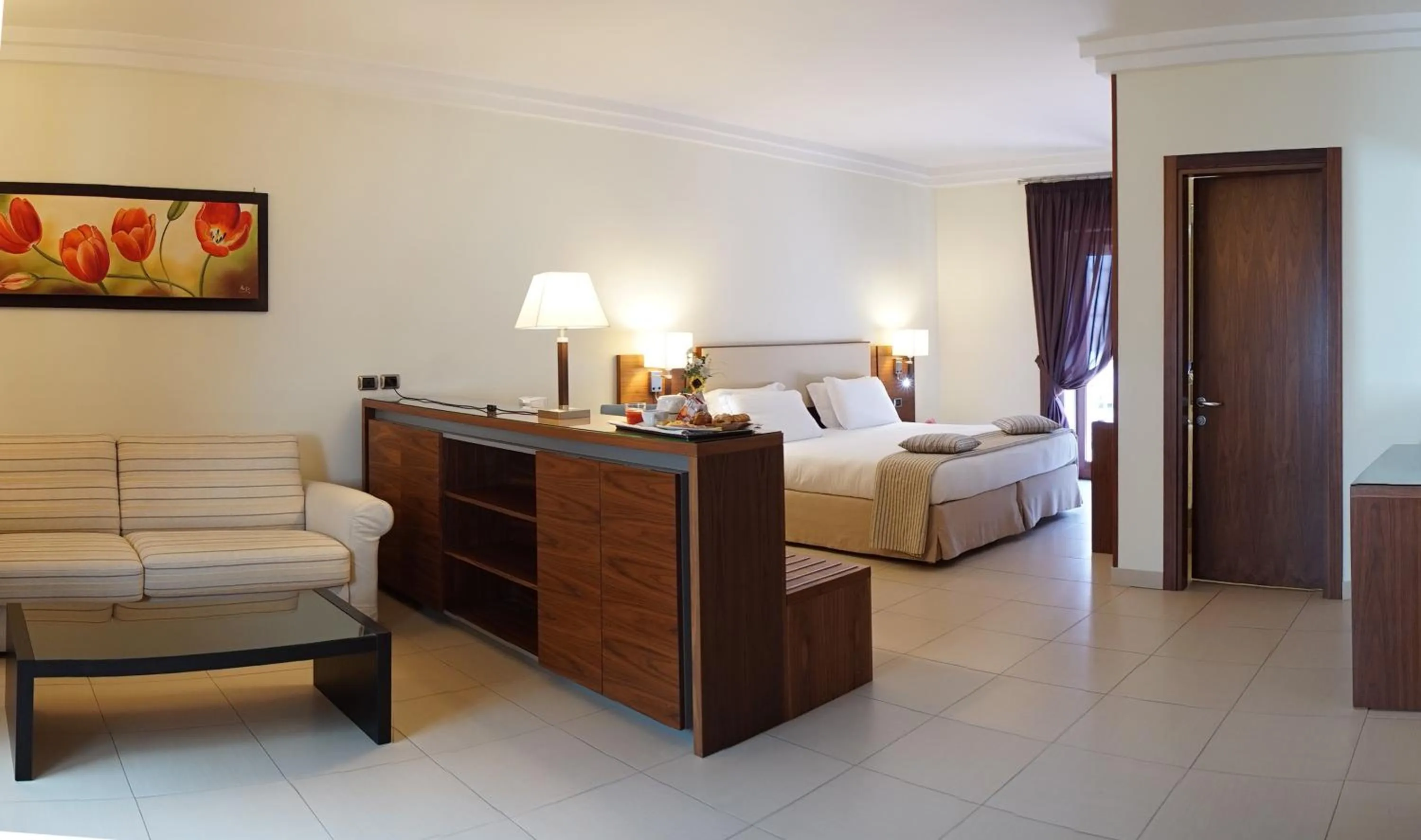 Bed in Suites & Residence Hotel