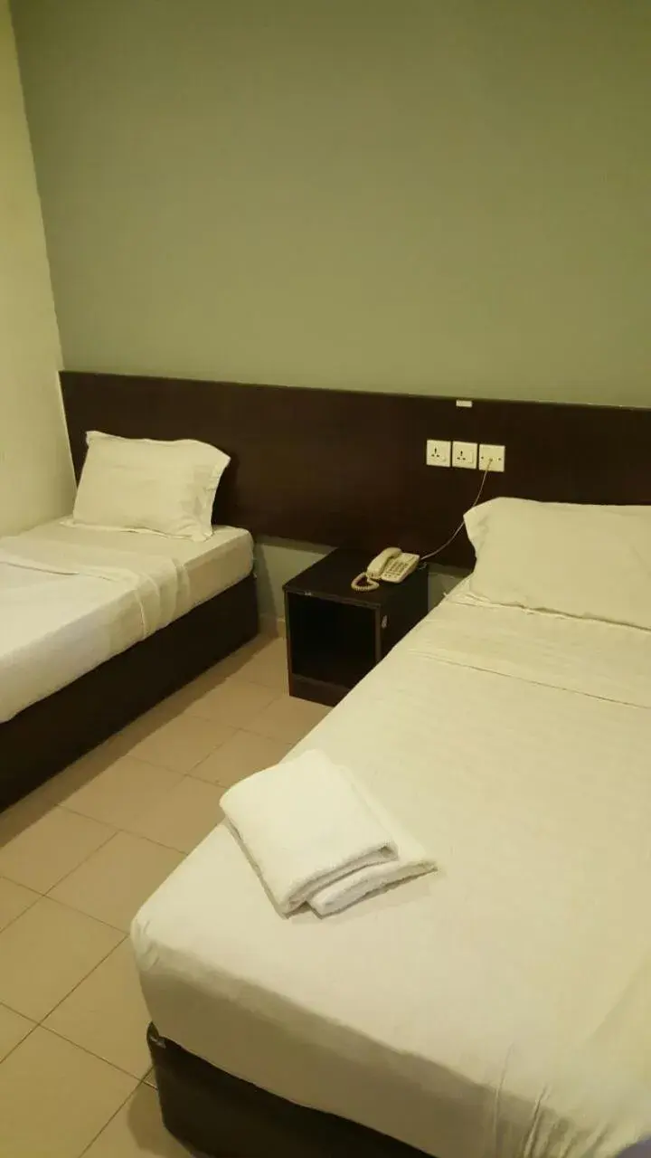 Bed in Tiong Nam Hotel