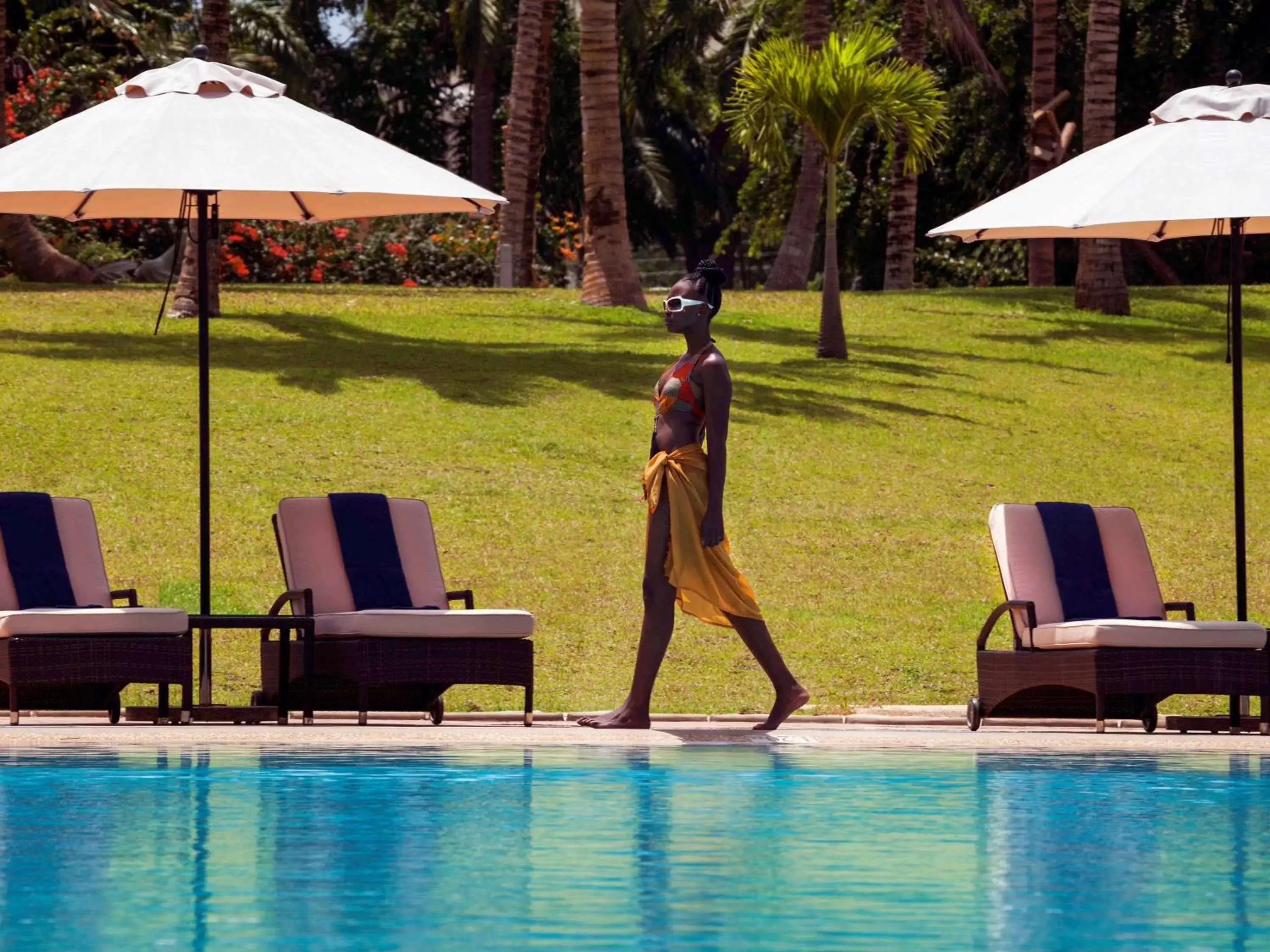 Lounge or bar, Swimming Pool in Mövenpick Ambassador Hotel Accra