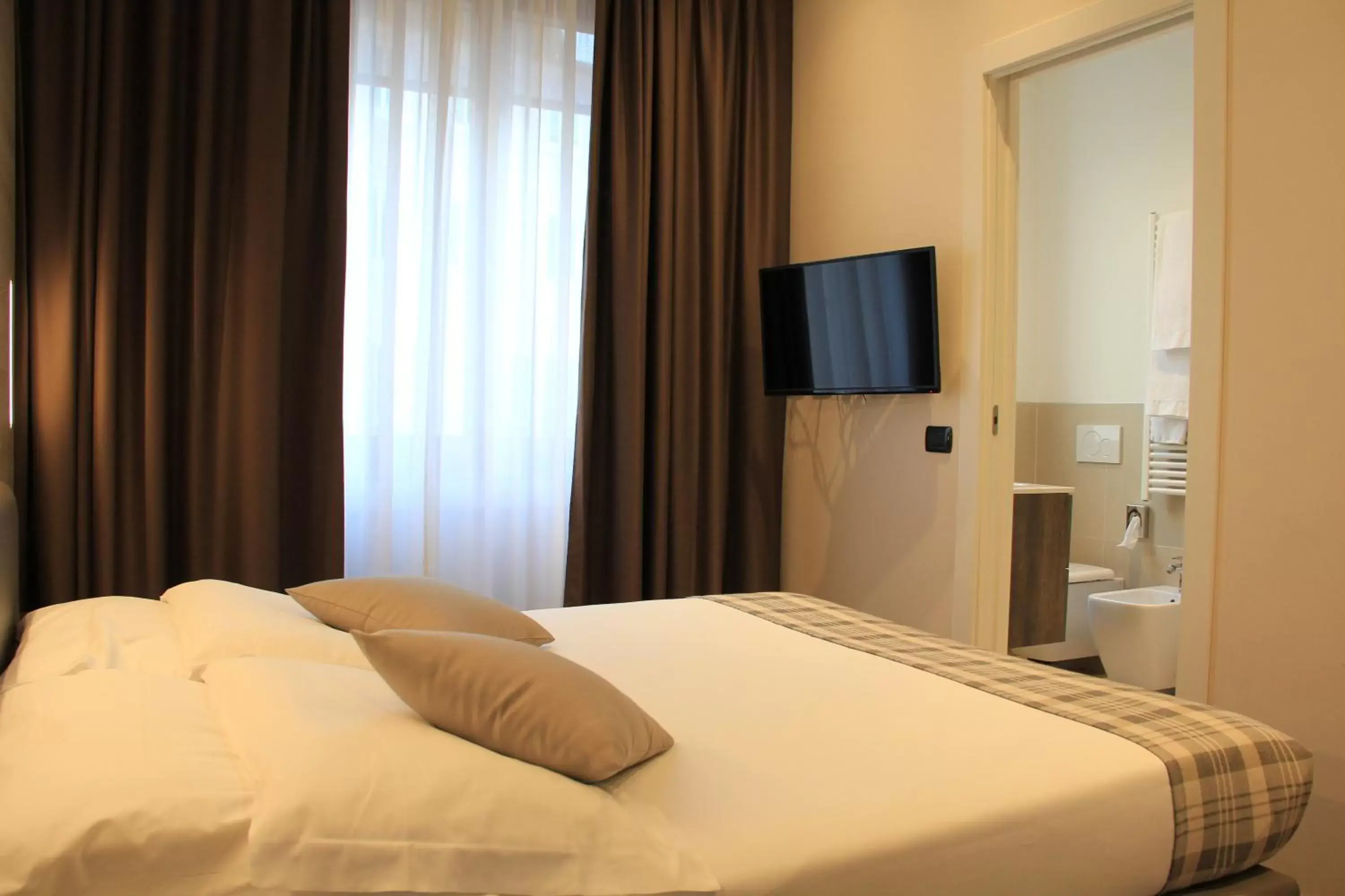 Bed in Duomo Hotel & Apartments