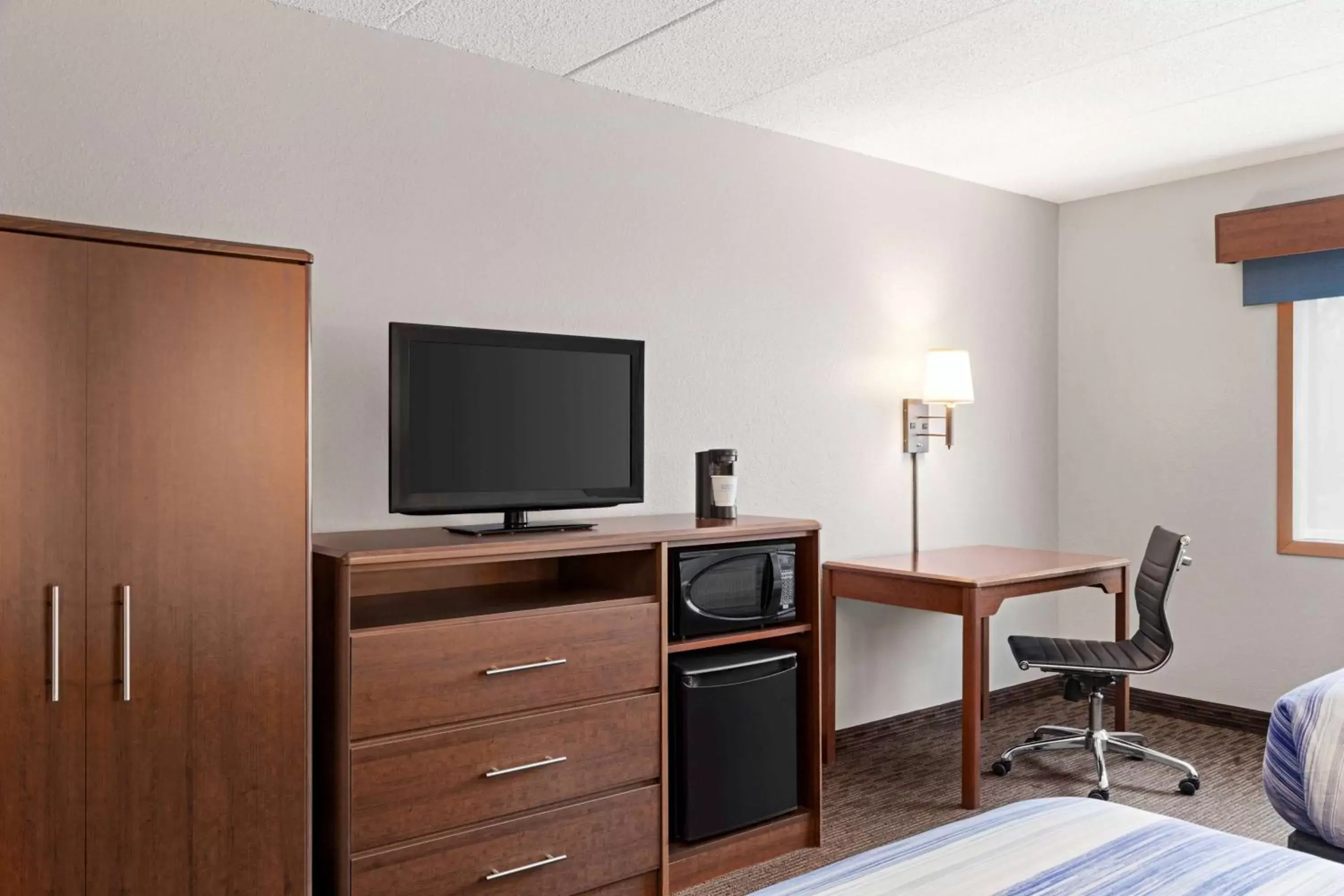 Photo of the whole room, TV/Entertainment Center in AmericInn by Wyndham Sauk Centre