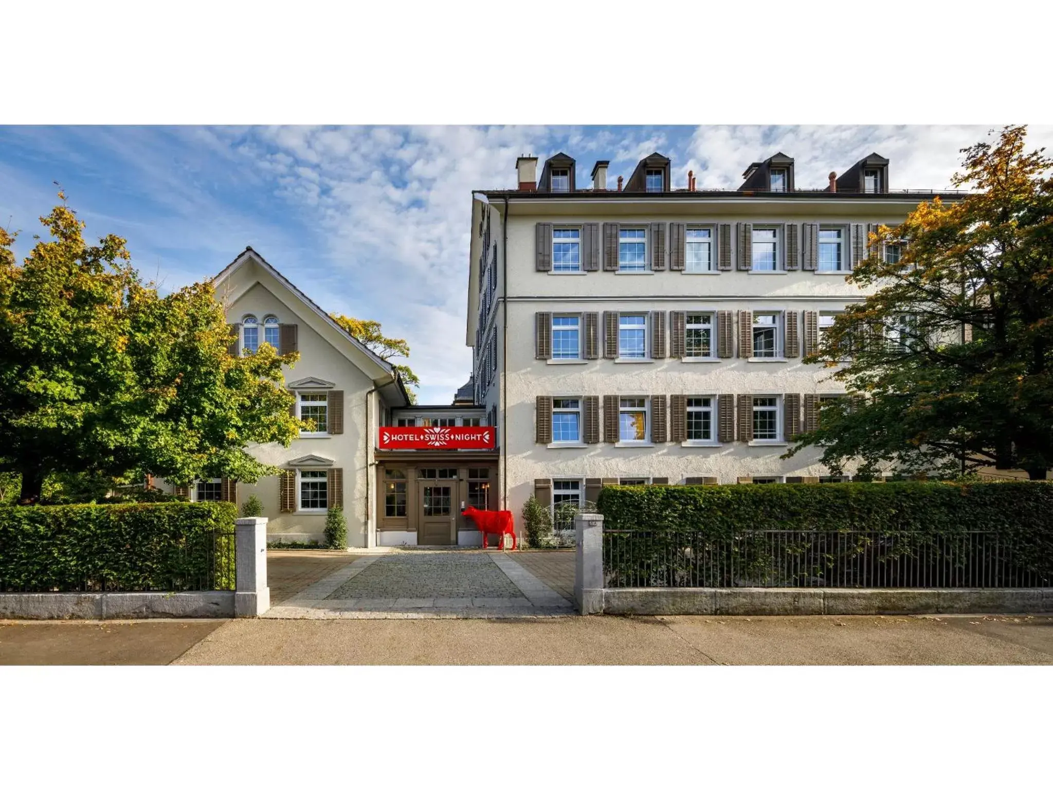 Facade/entrance, Property Building in Swiss Night by Fassbind