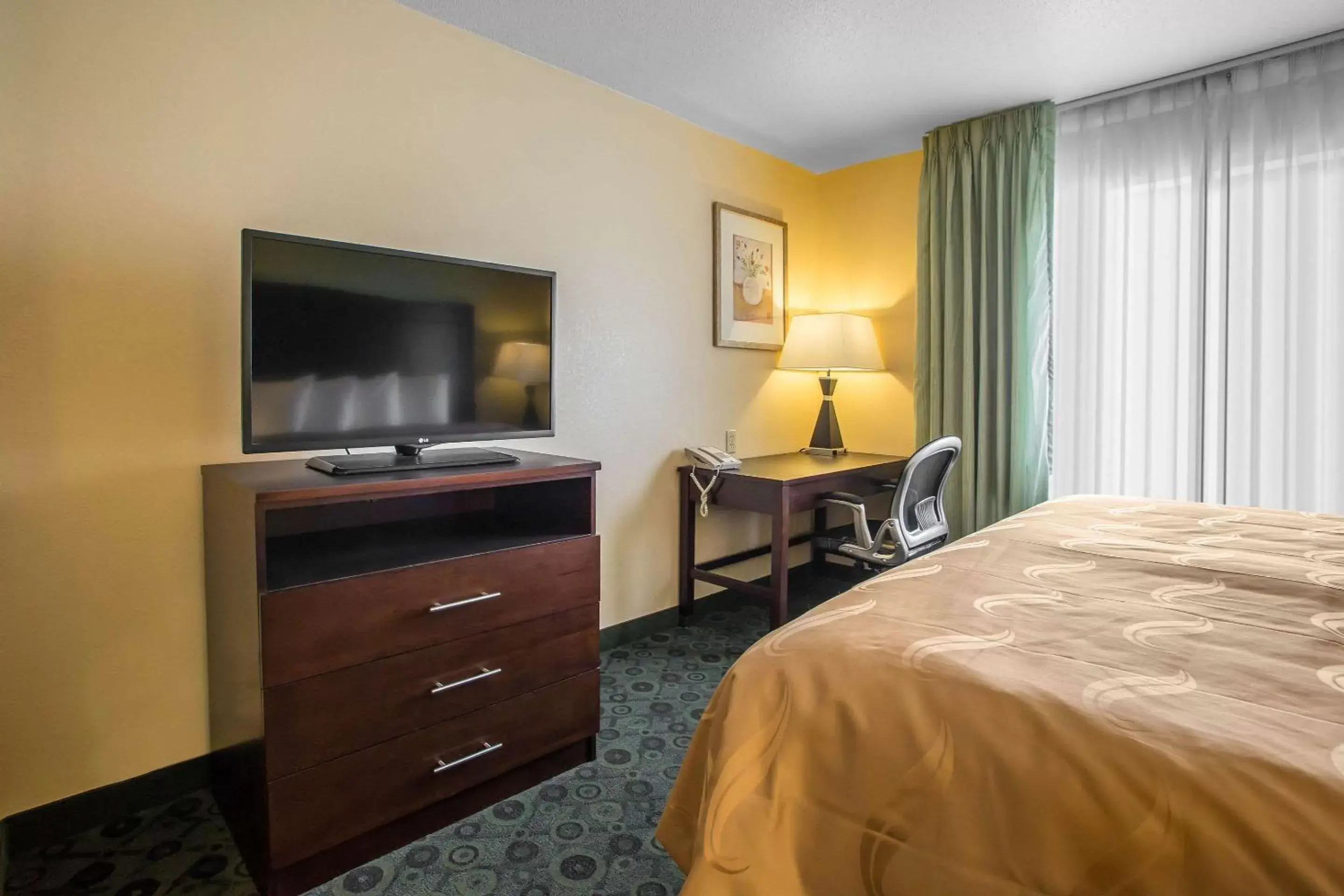 Photo of the whole room, TV/Entertainment Center in Quality Inn & Suites Bloomington I-55 and I-74