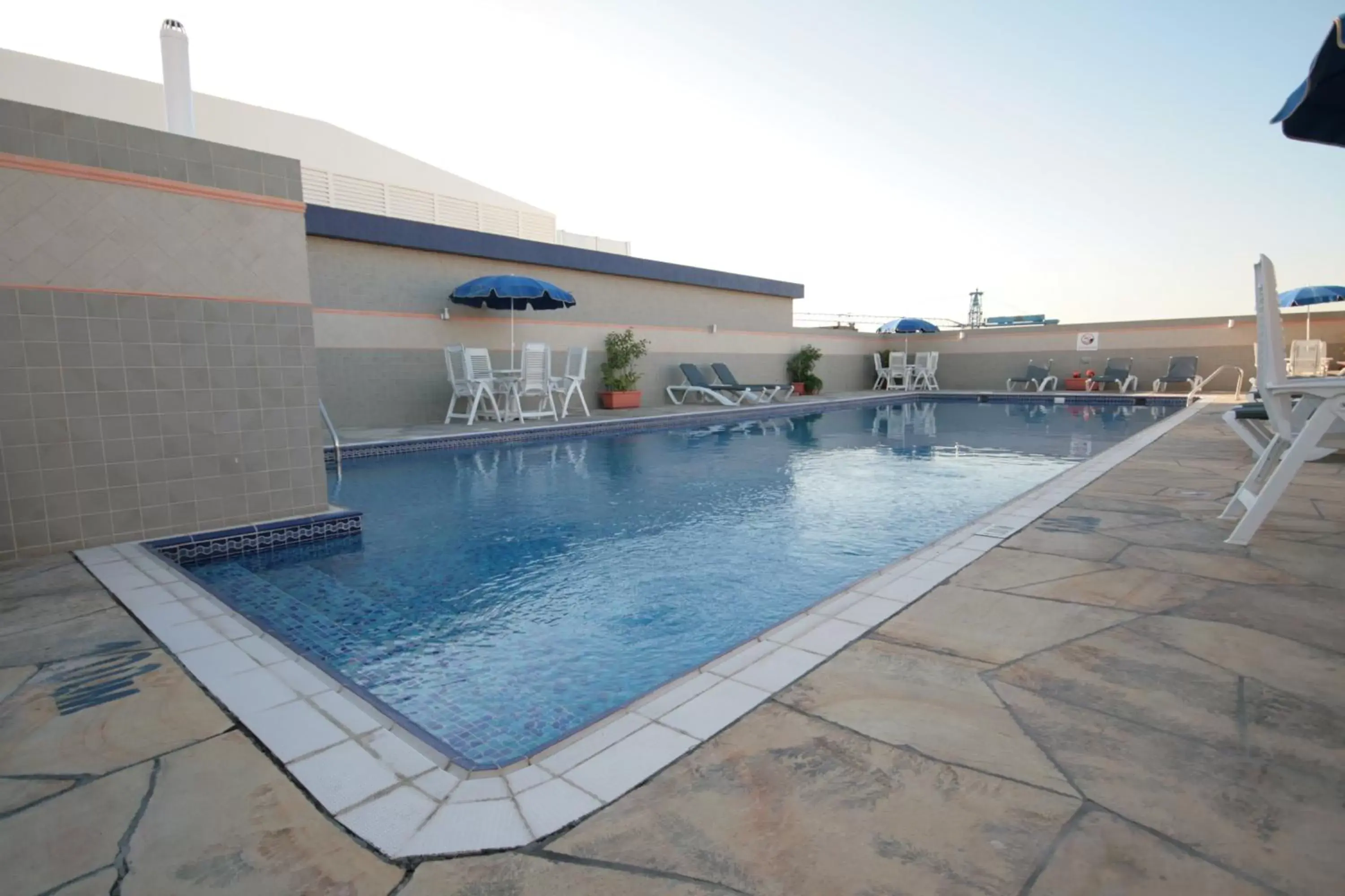 Swimming pool, Property Building in Rose Garden Hotel Apartments - Al Barsha, Near Metro Station