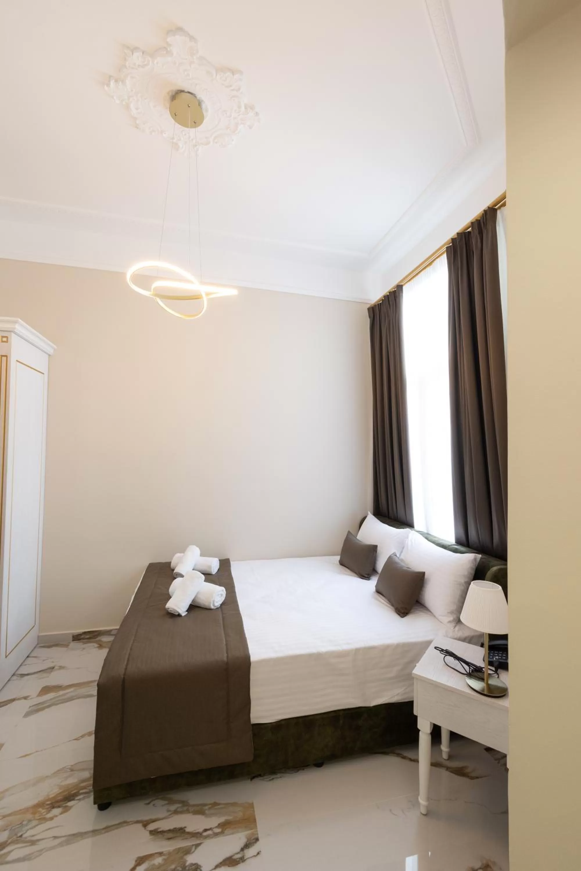 Bed in Modern Revival Luxury Hotel