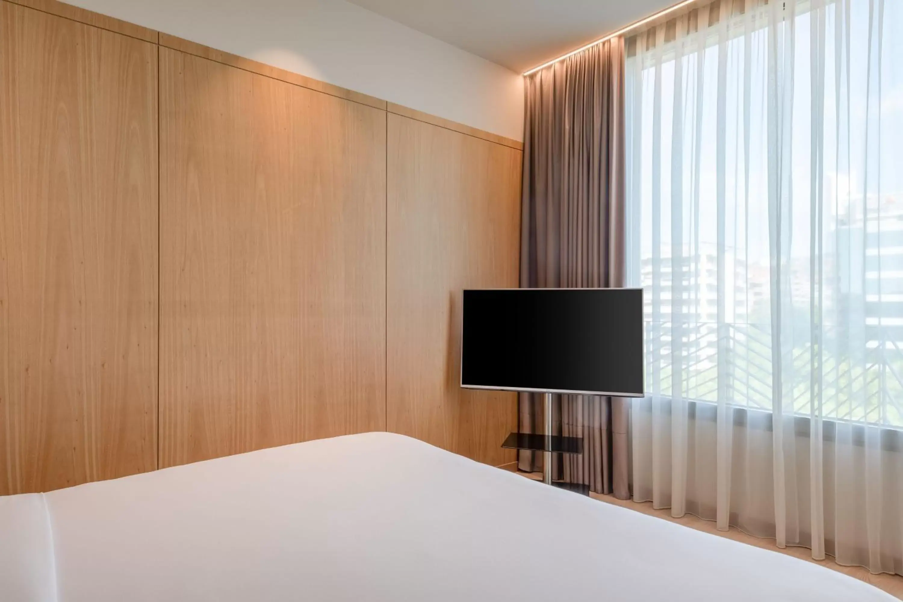 Bedroom, TV/Entertainment Center in AC Hotel Diagonal L'Illa by Marriott
