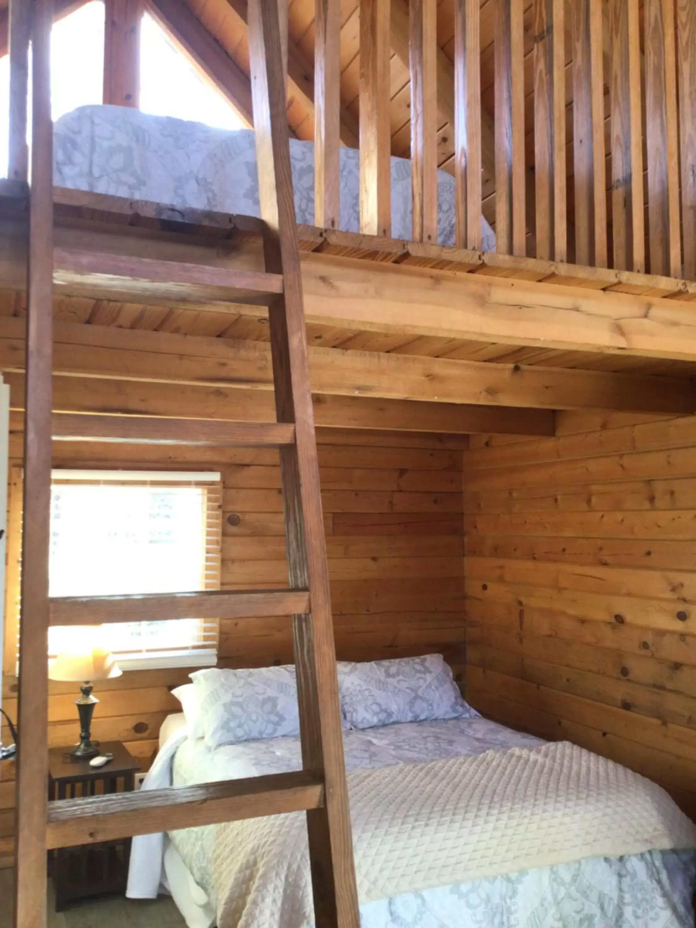 Bed in Kozy Haven Log Cabin Rentals