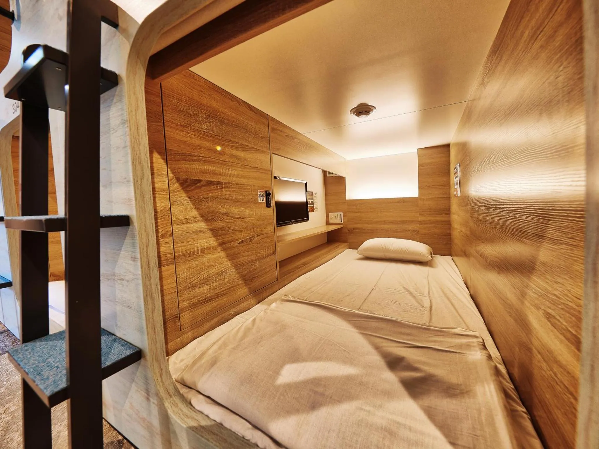 Bed in CABIN&HOTEL ReTIME