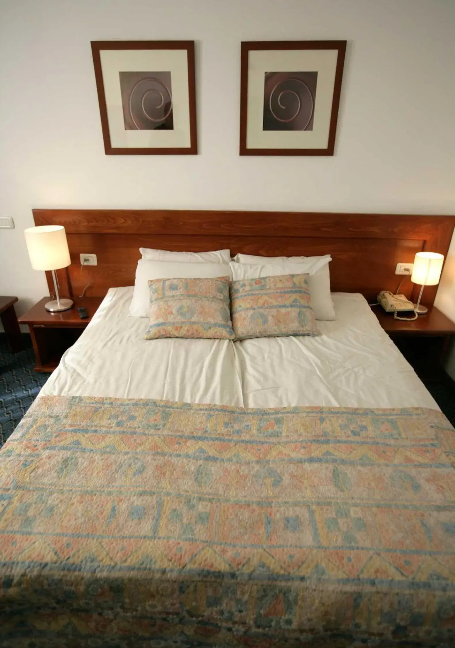 Bed in Caesar Premier Jerusalem Hotel