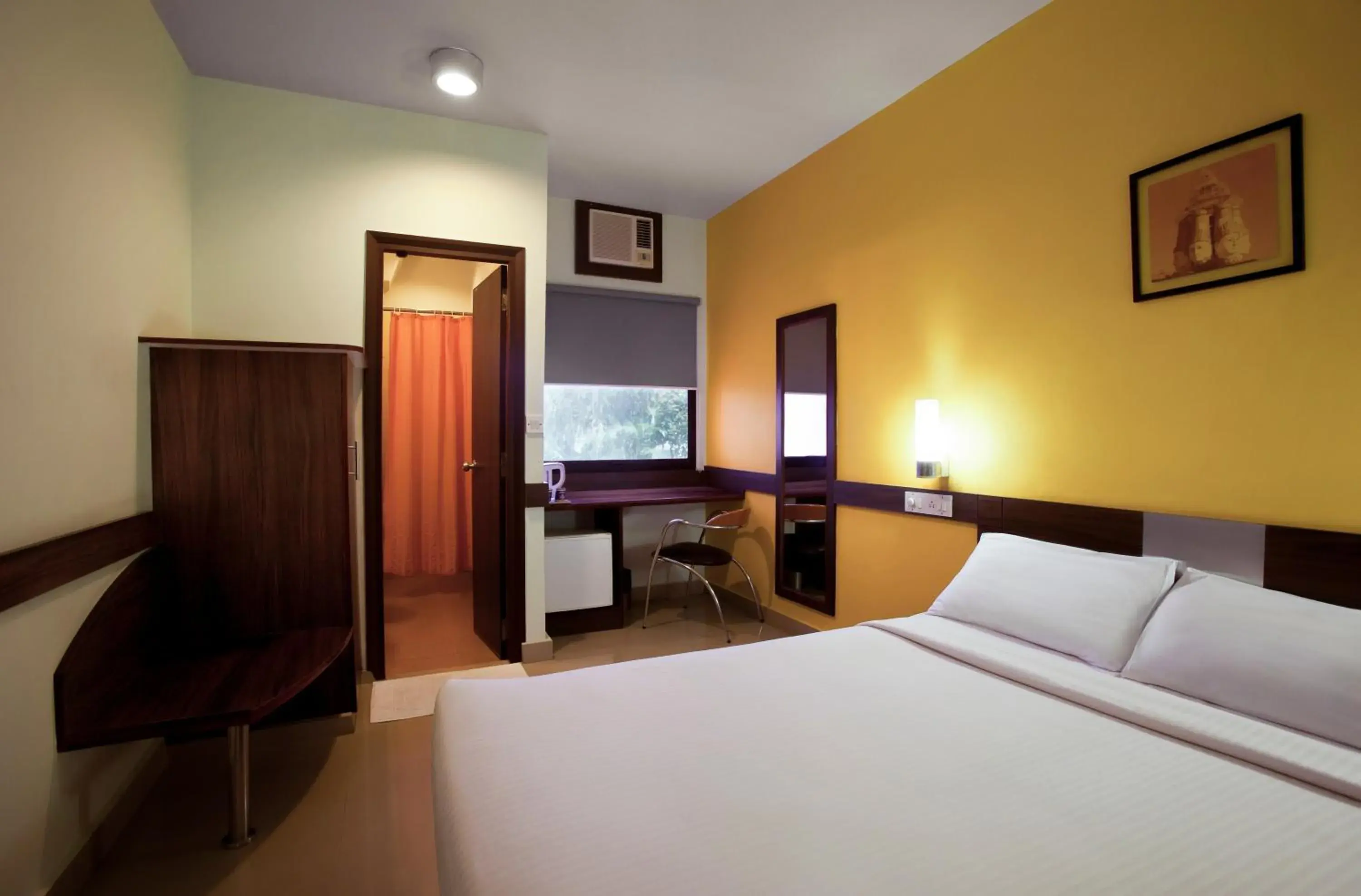 Bed in Ginger Hotel Nashik