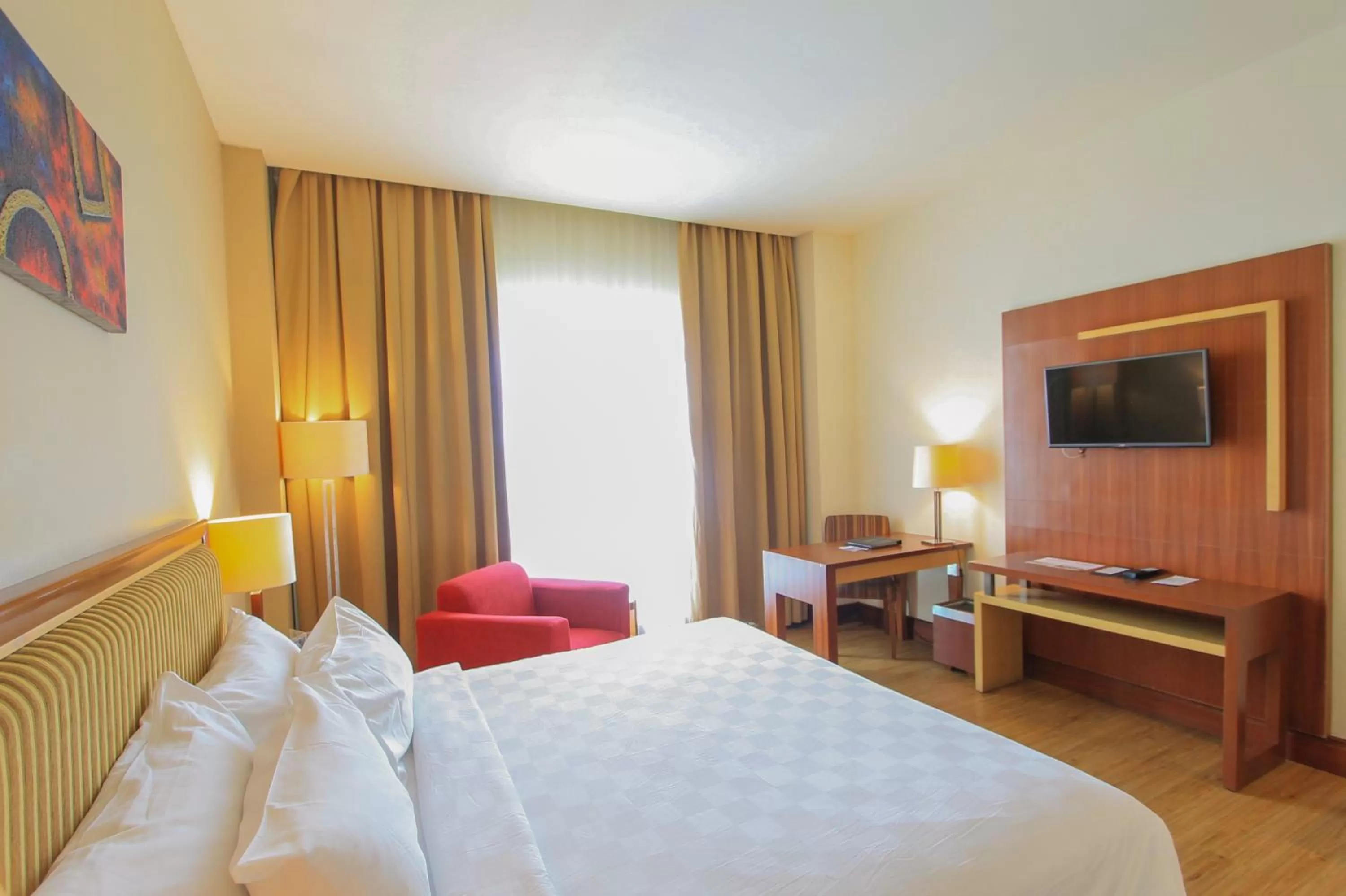Bed in Swiss-Belhotel Maleosan Manado
