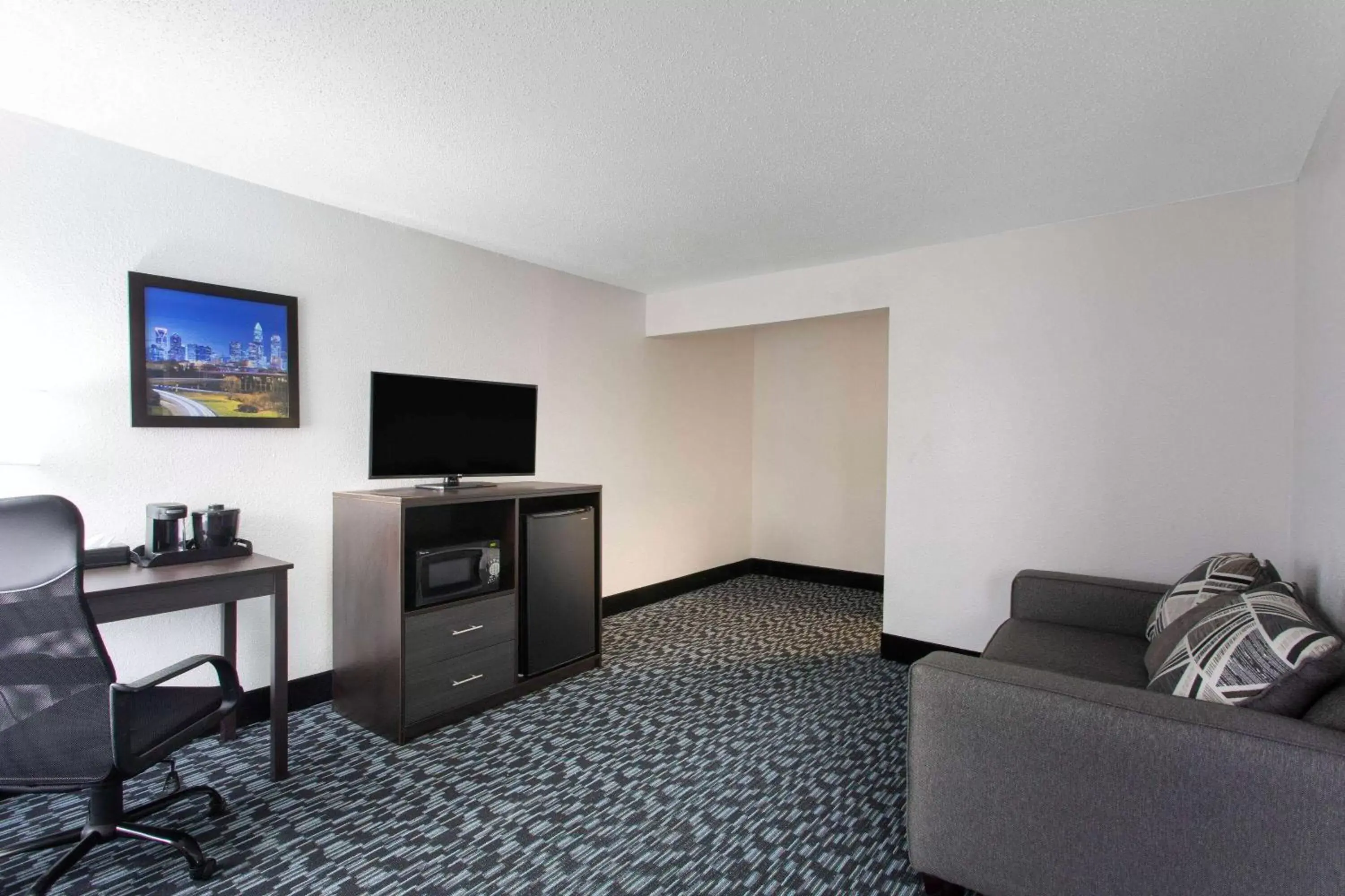 Photo of the whole room, TV/Entertainment Center in Baymont by Wyndham Charlotte University