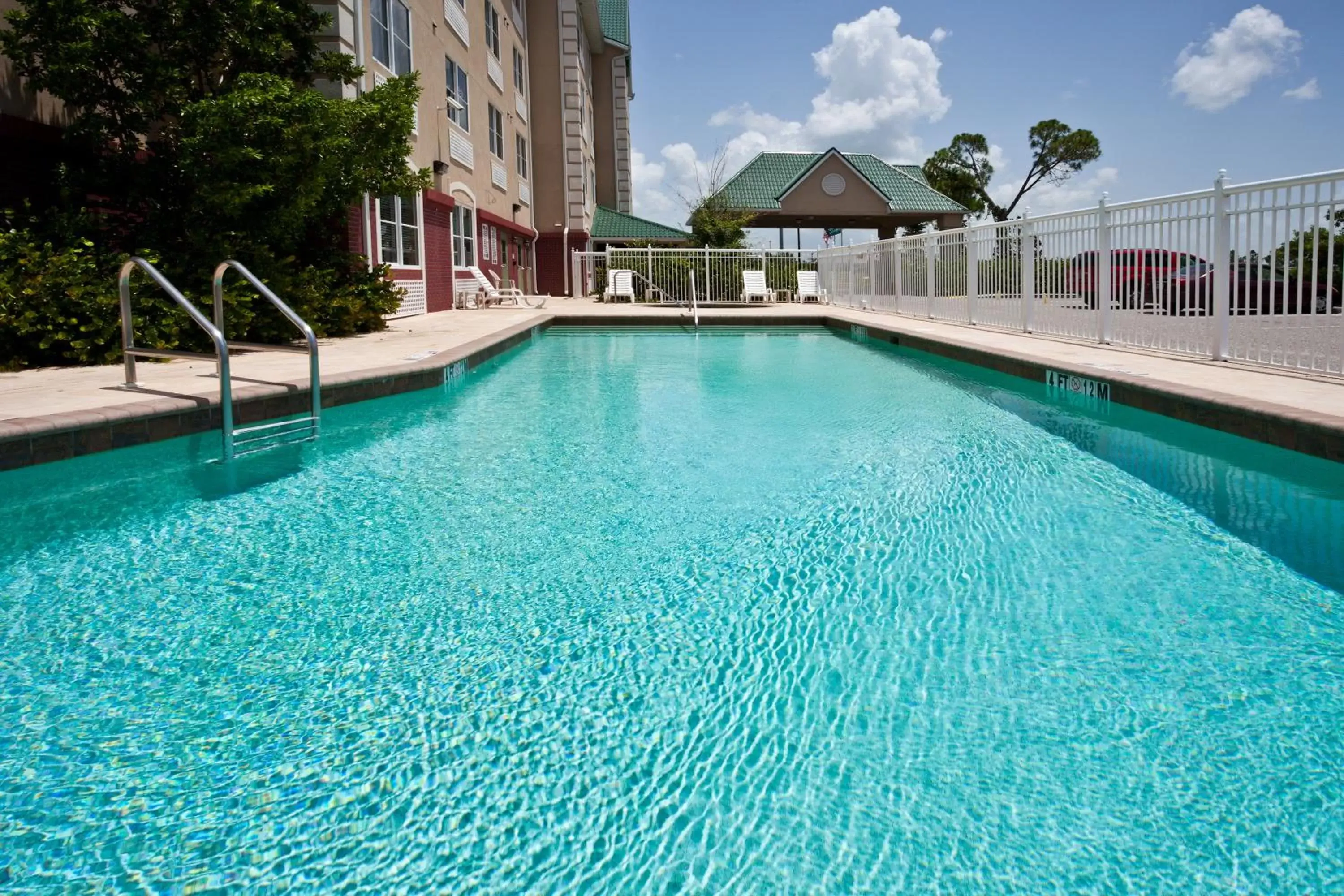 Swimming Pool in Country Inn & Suites by Radisson, Port Charlotte, FL