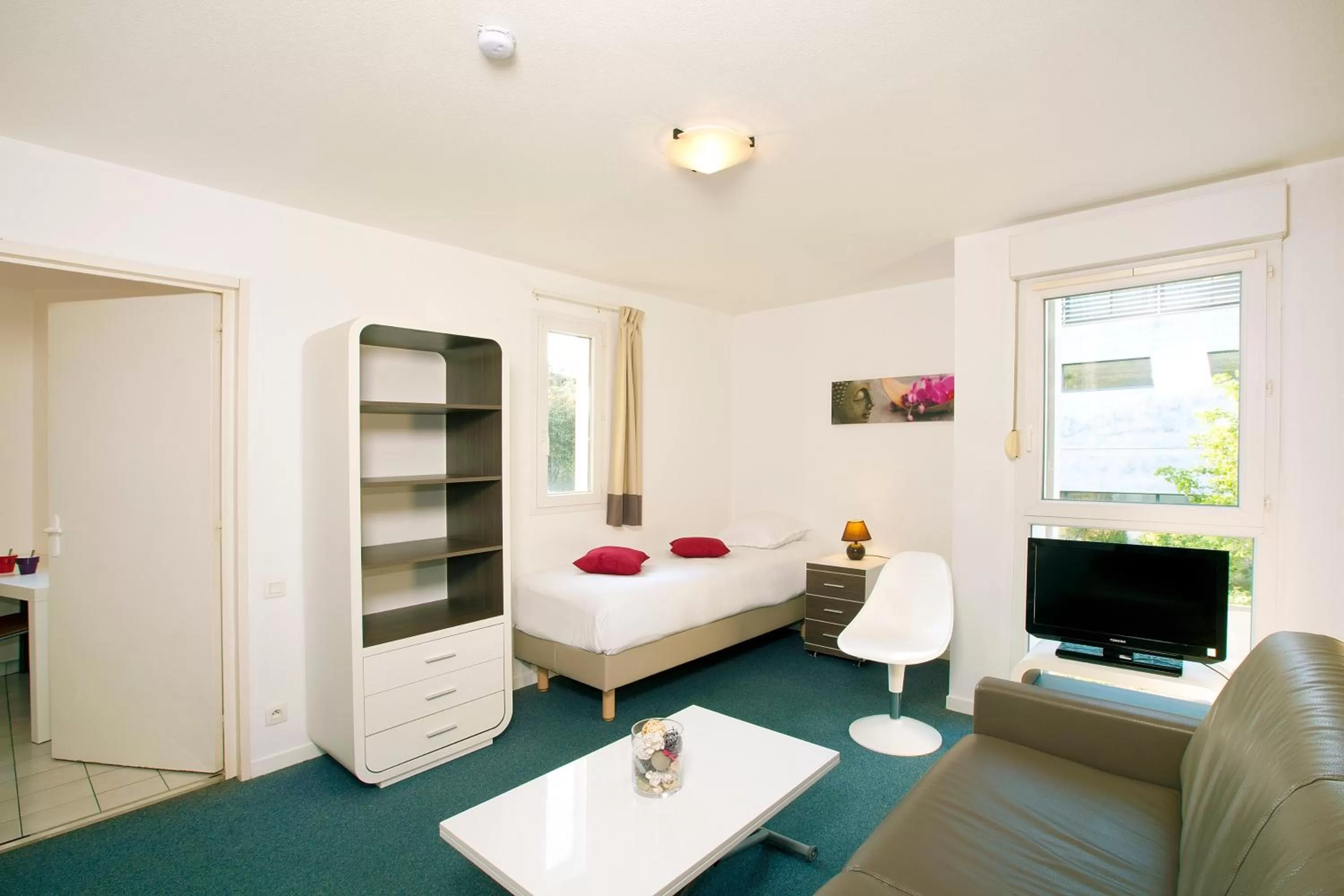 Living room, Bed in Séjours & Affaires La Rochelle Les Minimes