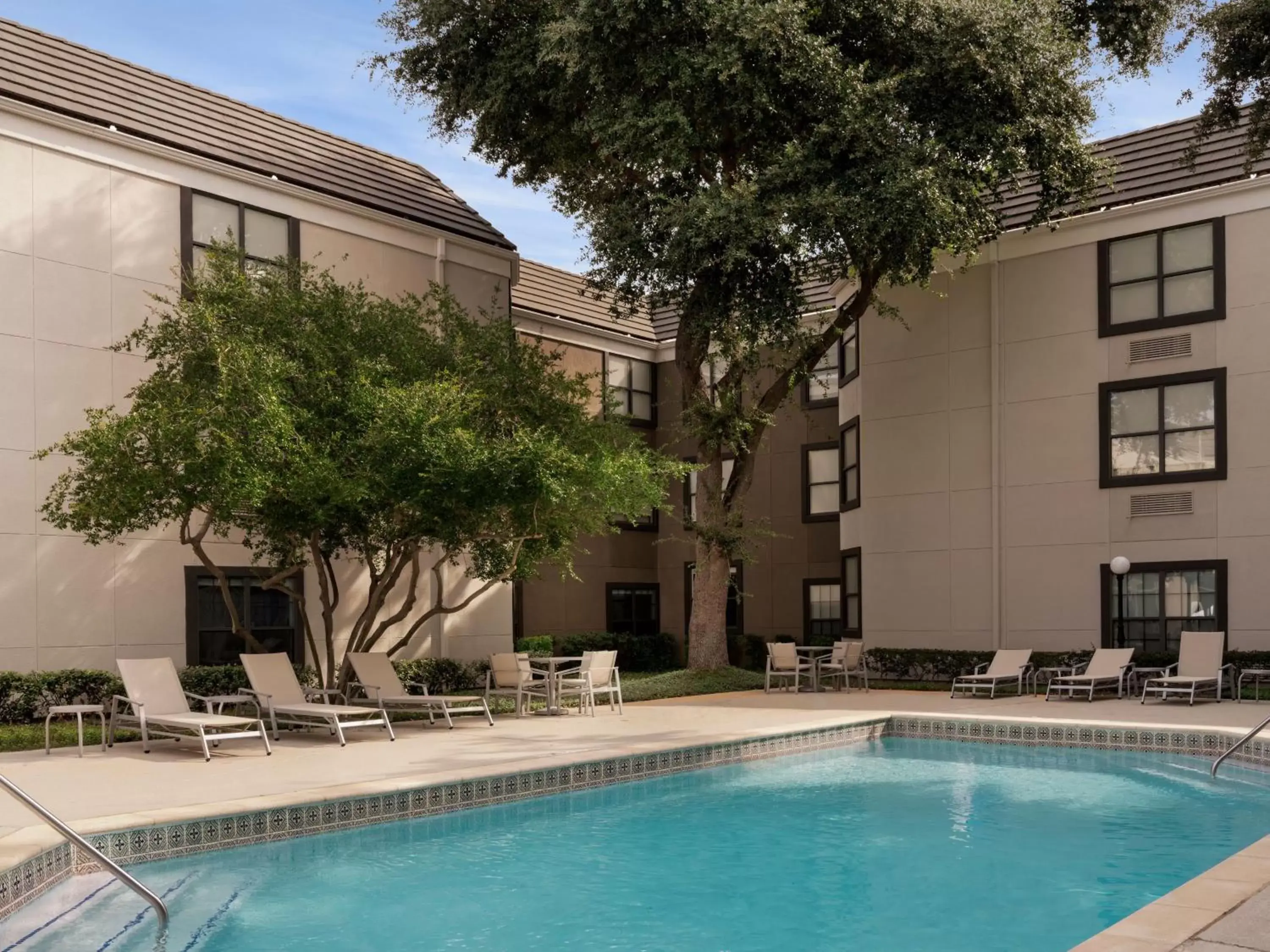 Swimming pool, Property Building in Holiday Inn Express Hotel & Suites Irving DFW Airport North, an IHG Hotel