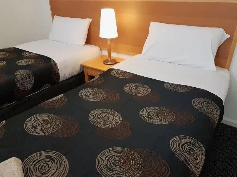 Bed in Mahogany Motel