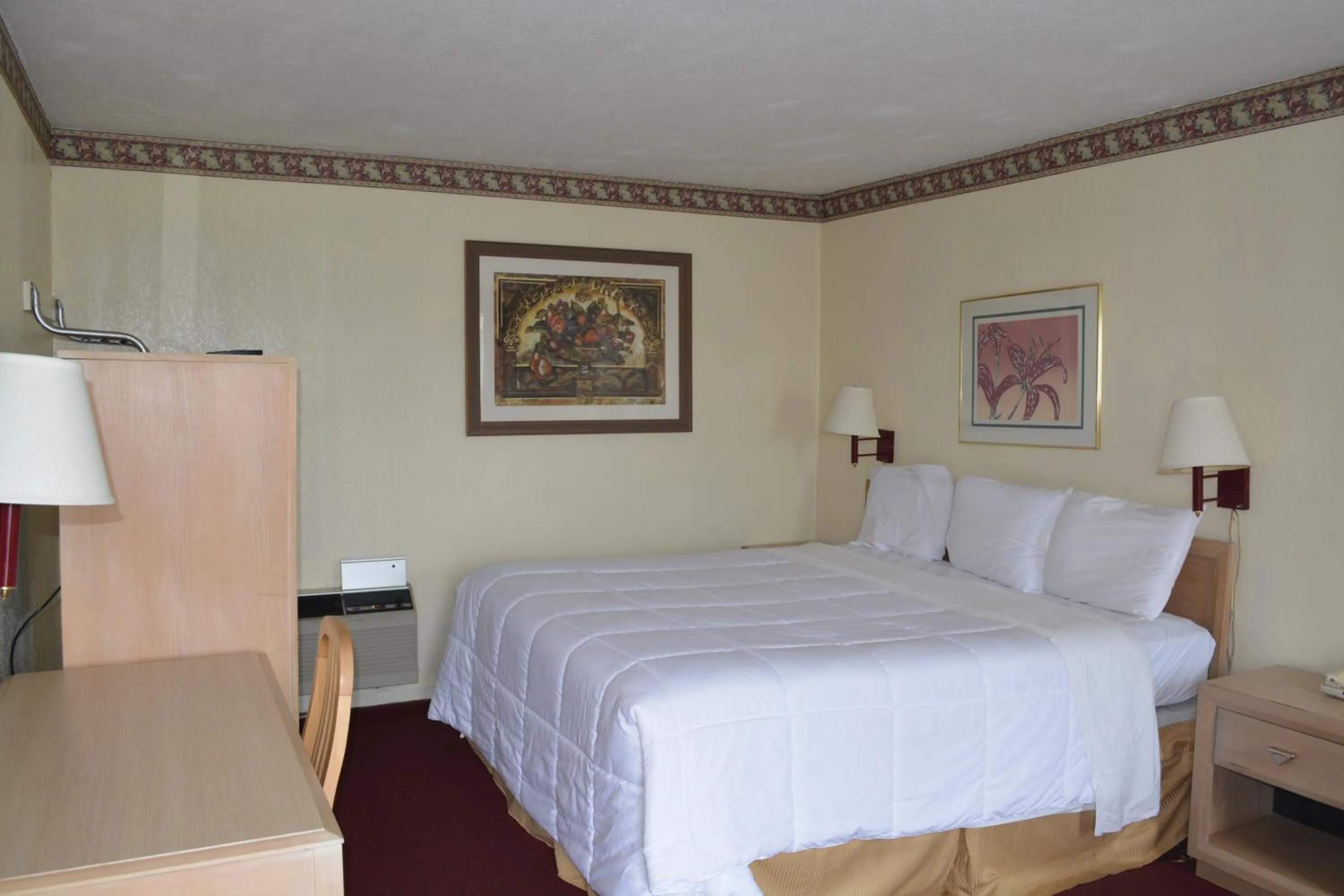 Bed in Knights Inn Hurricane Mills