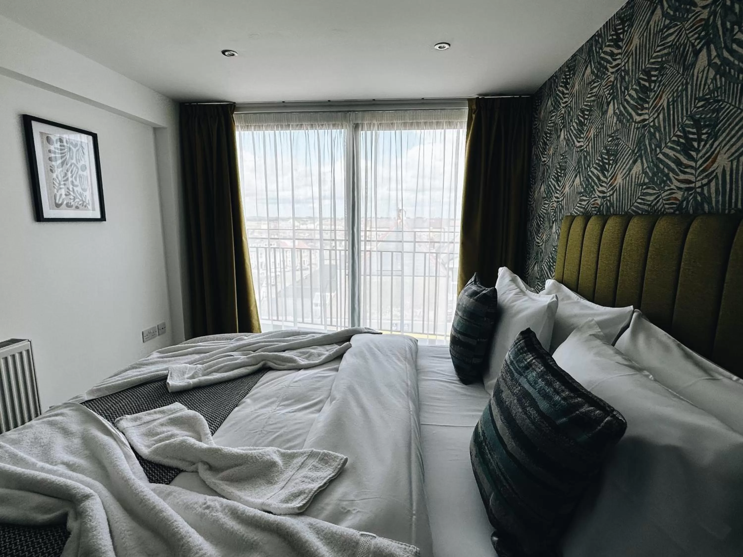 Bed in The Atlantis - Tower Apartments