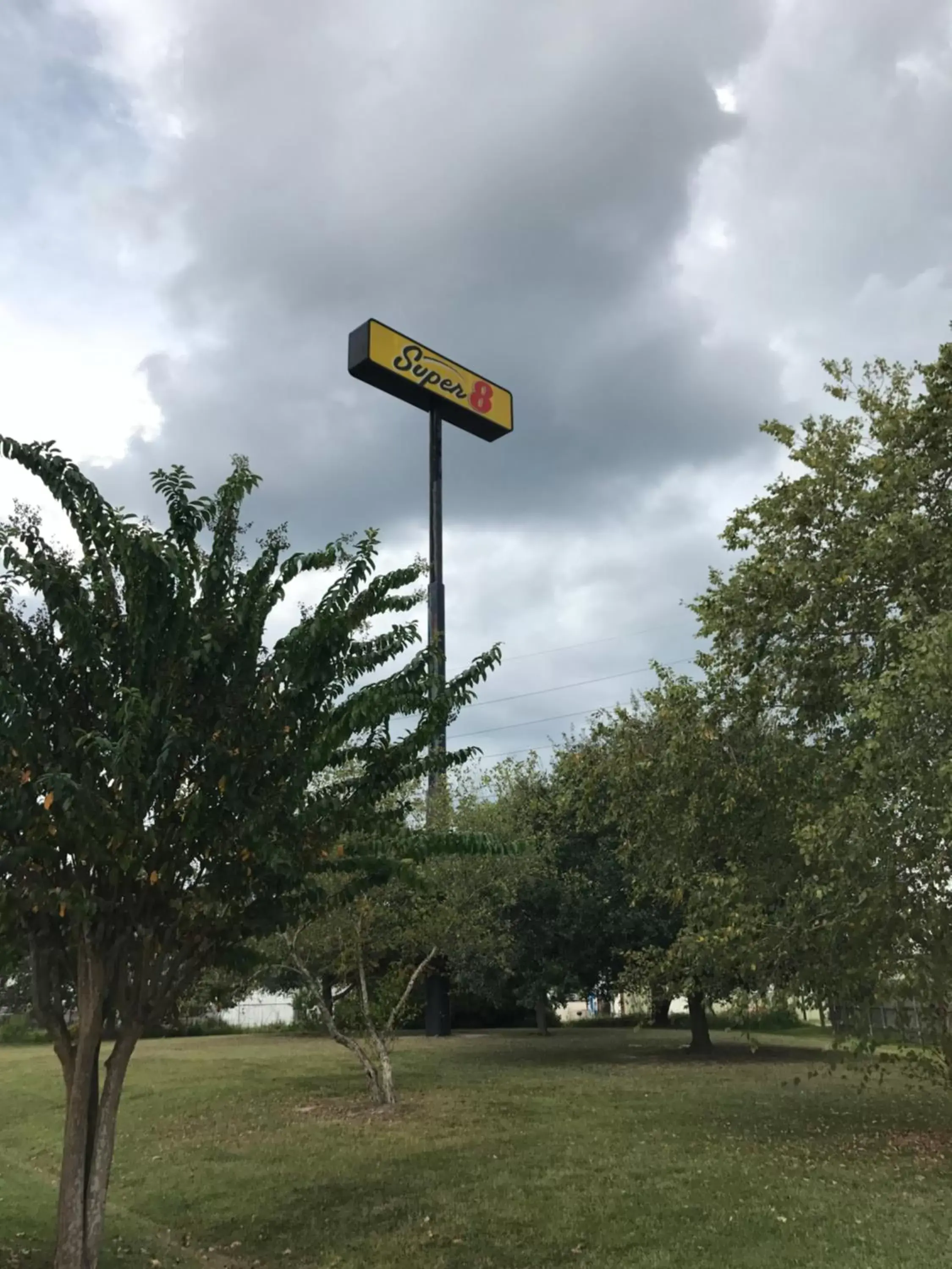 Property logo or sign in Super 8 by Wyndham Slidell