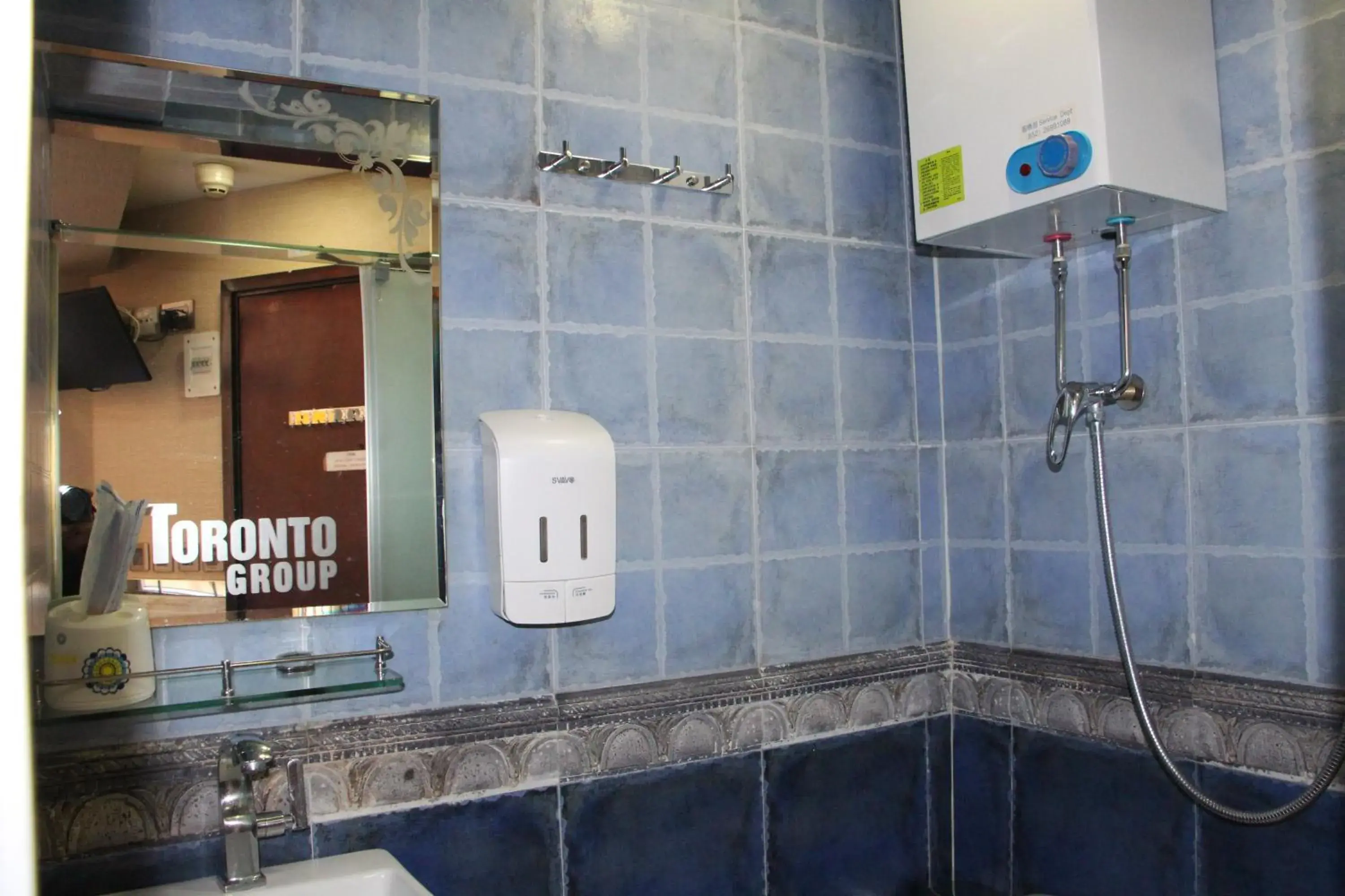 Bathroom in Temple Street Hotel - Toronto Motel Group
