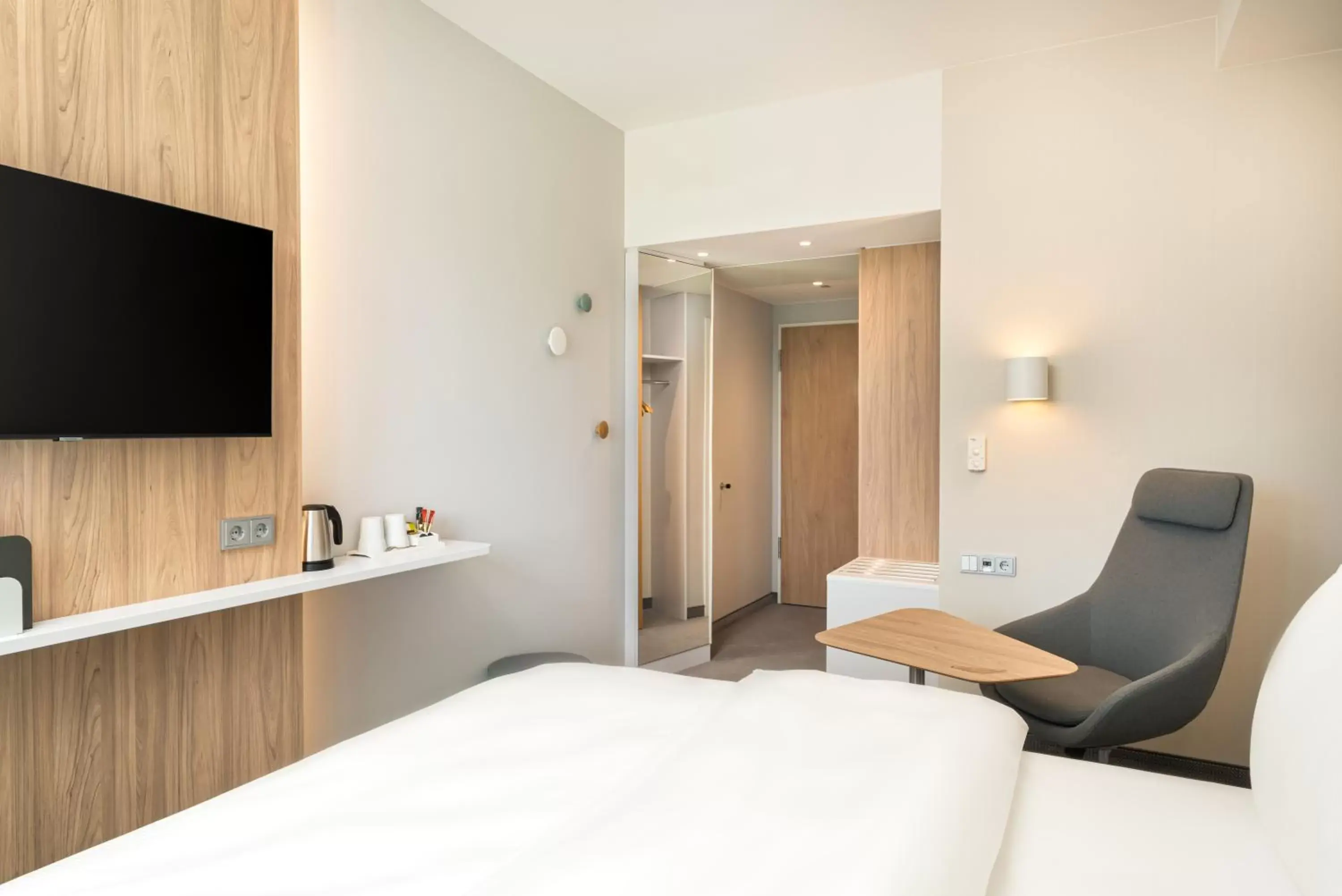 wardrobe, Bed in Holiday Inn Express - Rosenheim, an IHG Hotel