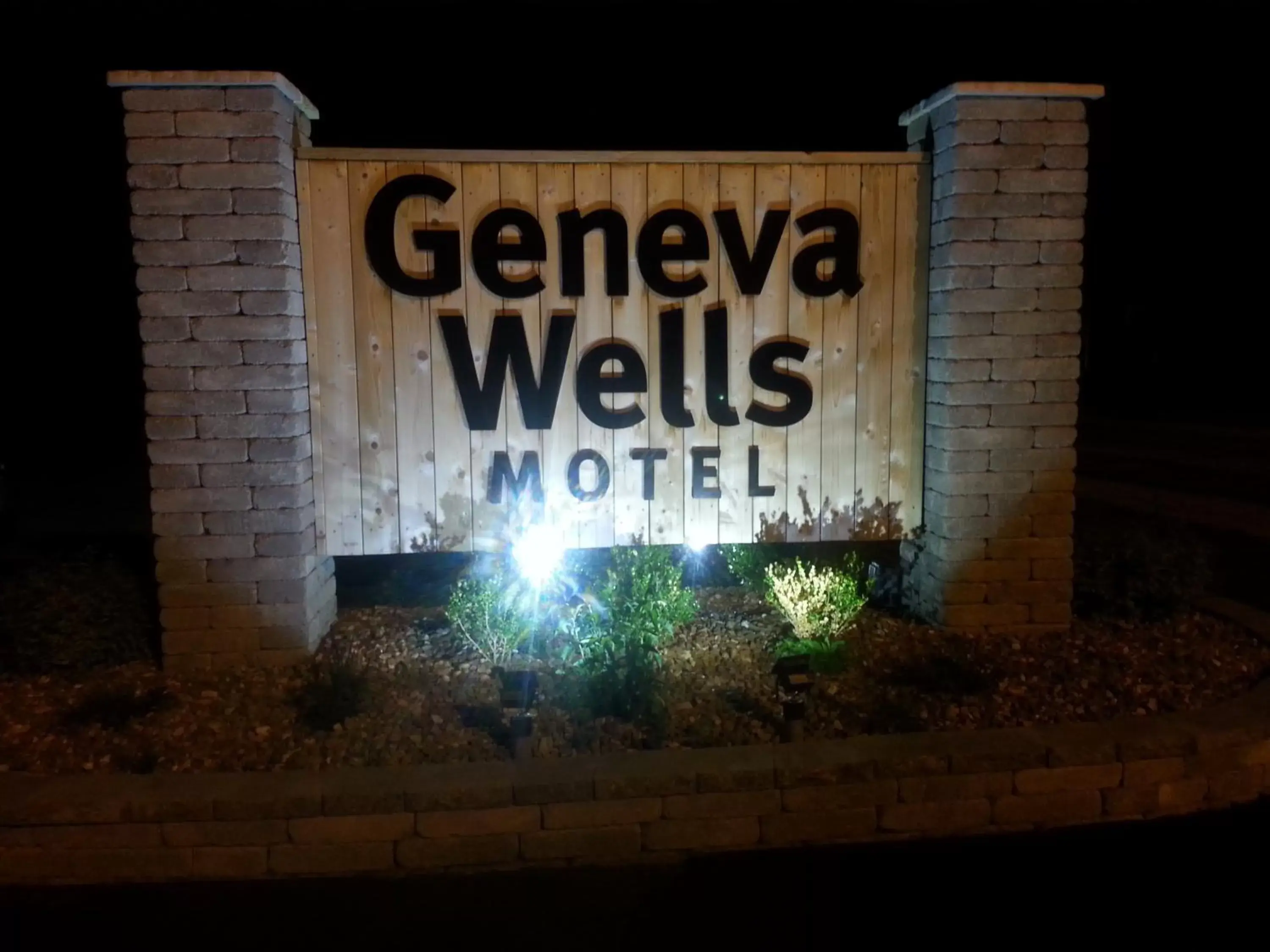 Property logo or sign in Geneva Wells Motel