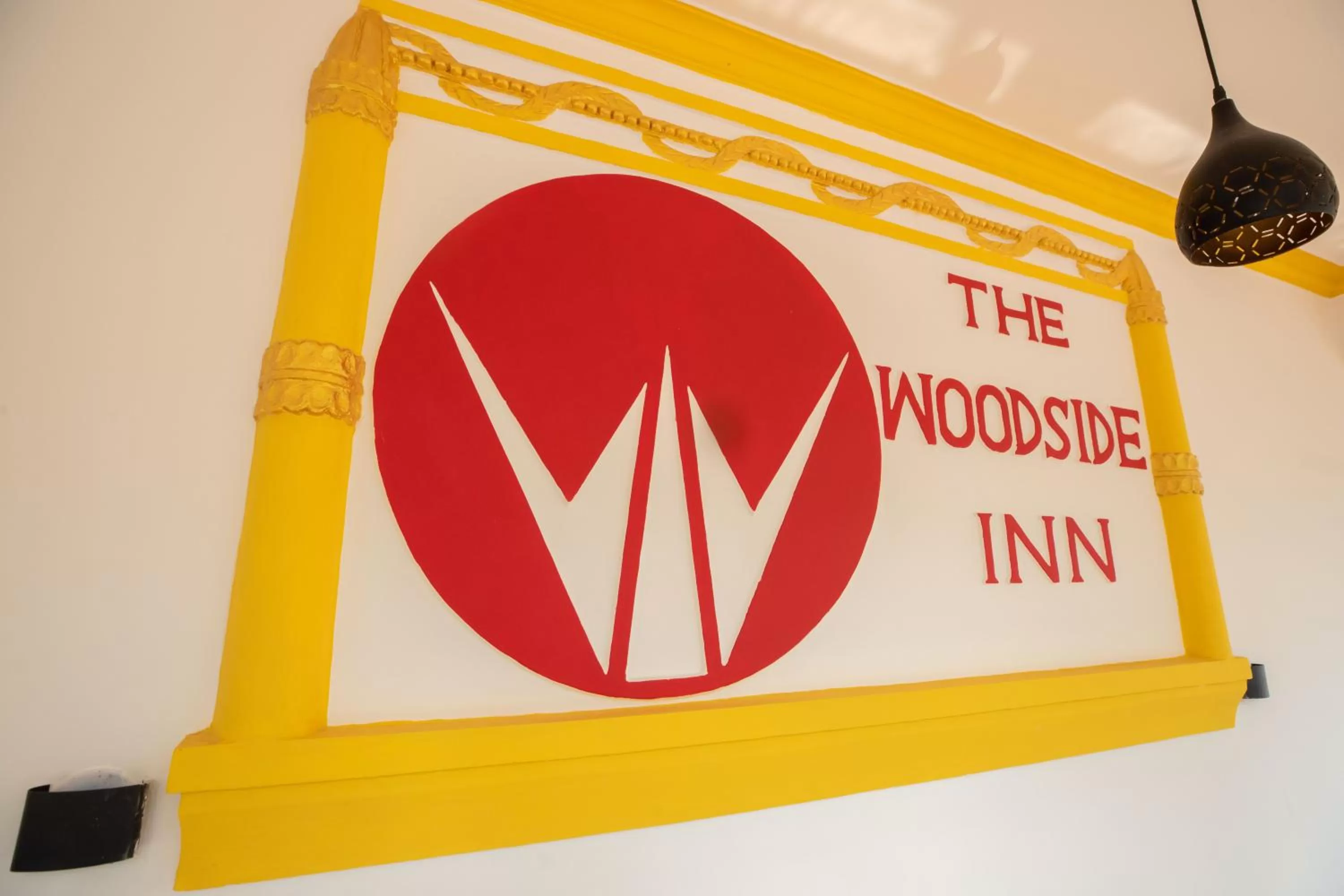 Property logo or sign in The Woodside Inn