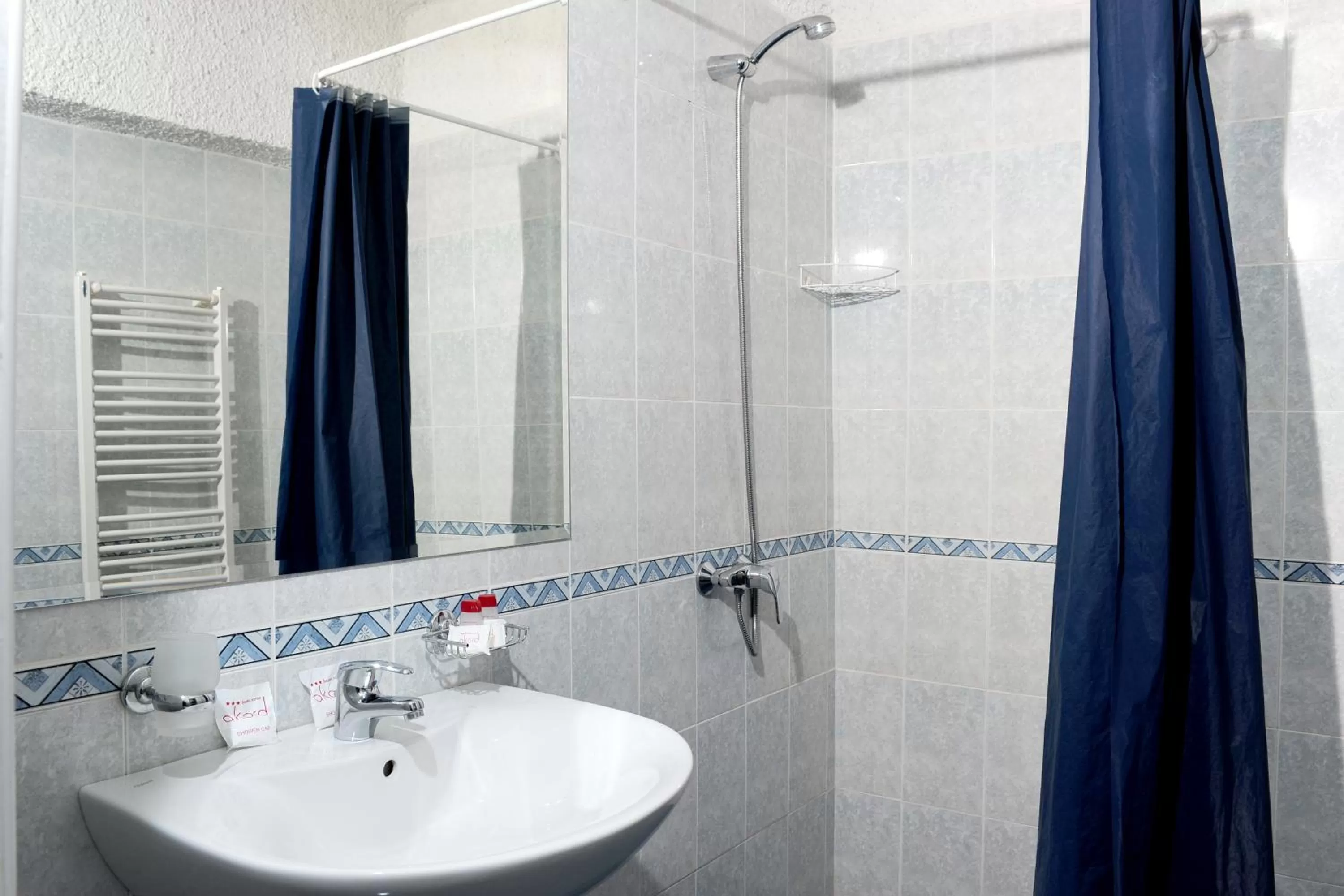 Bathroom in Hotel Akord - Free Parking & Metro Access