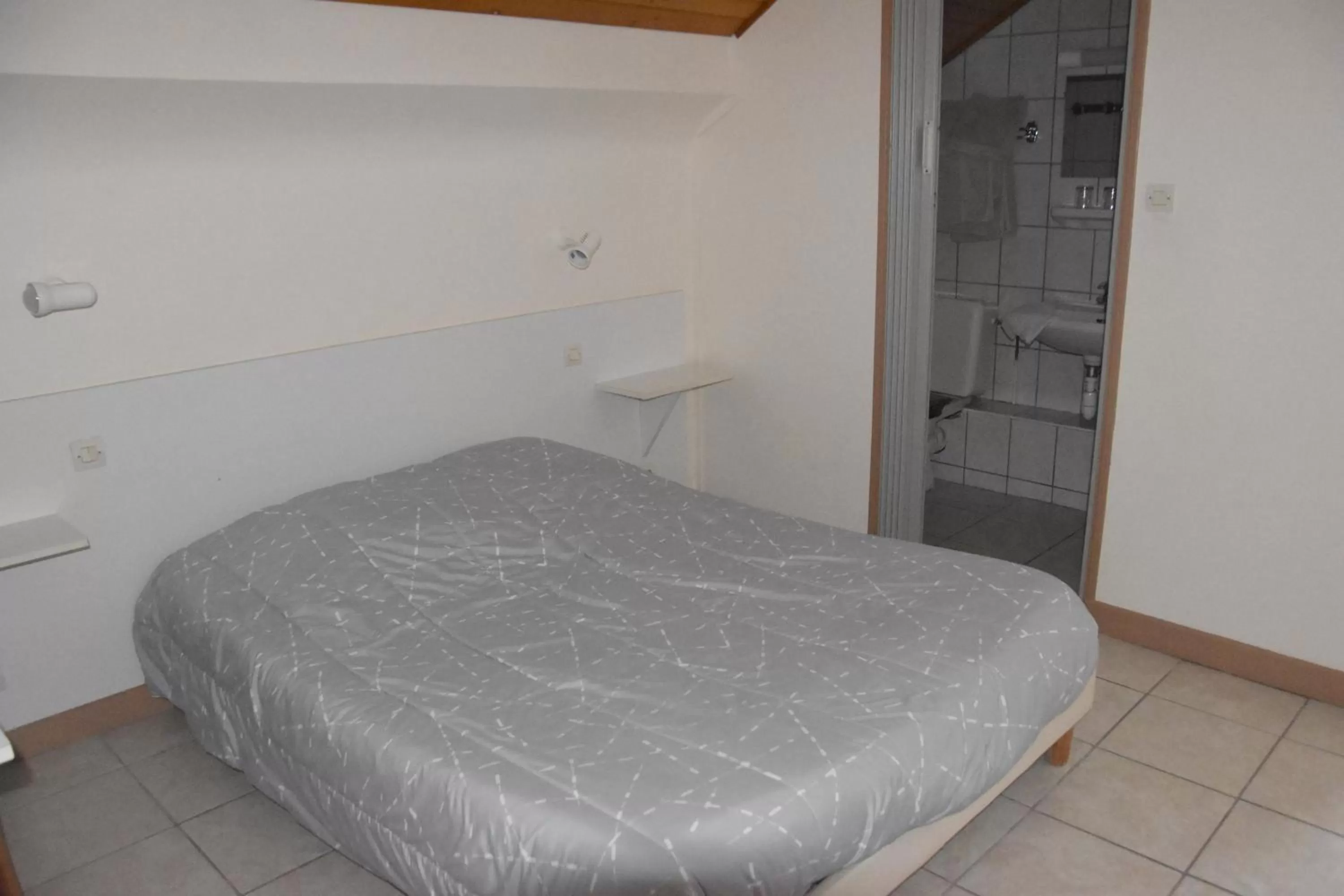 Bed in Hotel Gai Relais