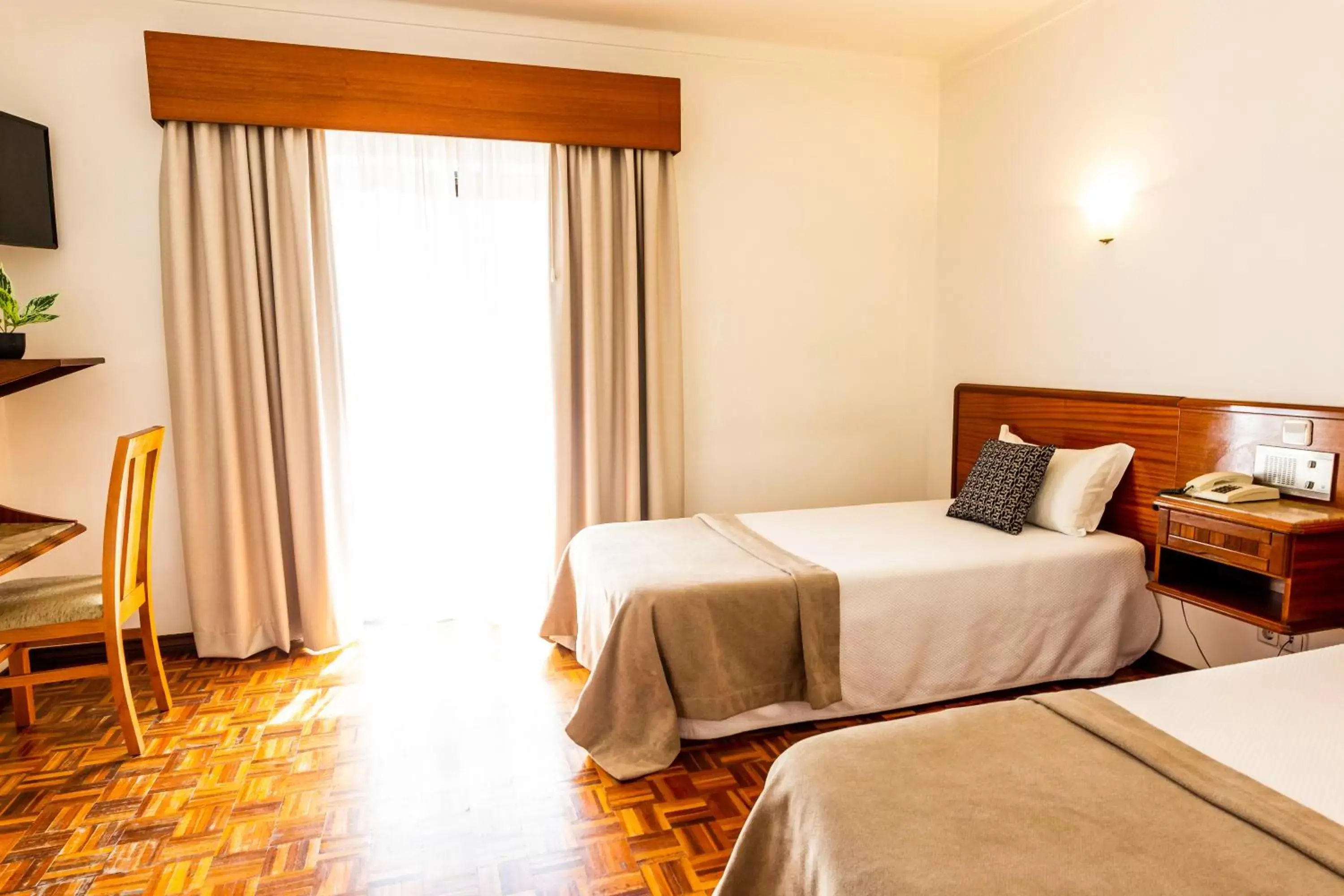 Bed in Dona Amélia Hotel by RIDAN Hotels