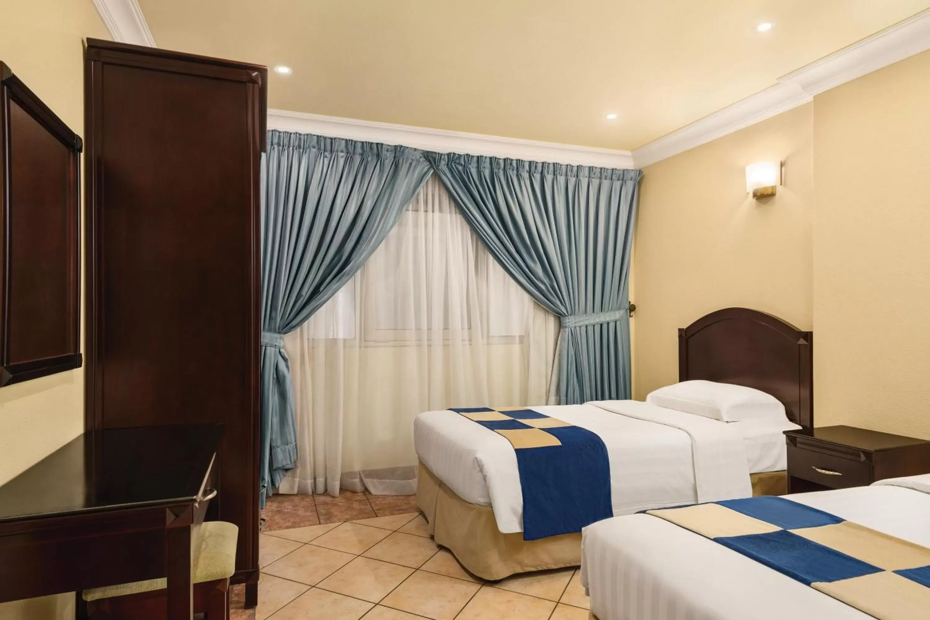 Bed in Howard Johnson Dammam Hotel