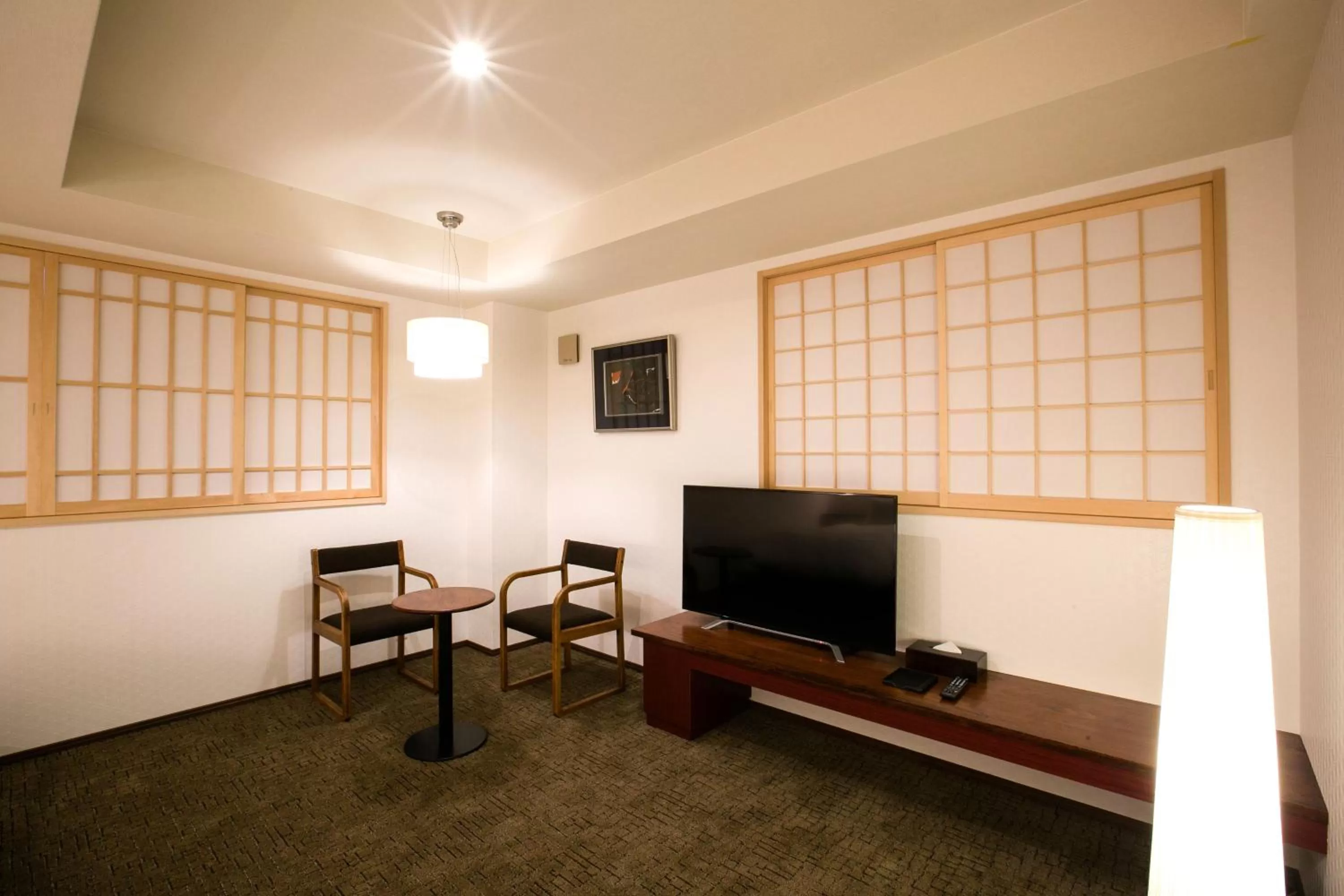 Communal lounge/ TV room in Kyoto Kamanza Hotel