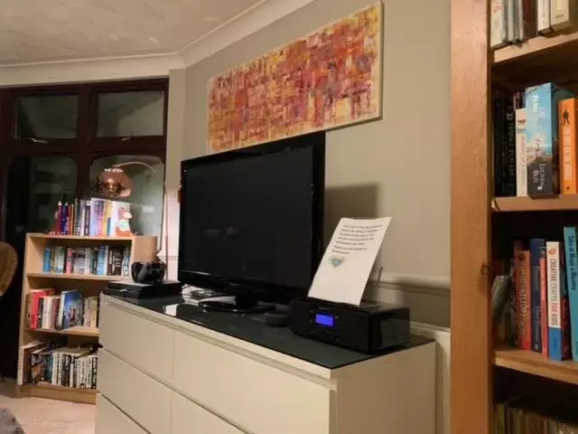 Communal lounge/ TV room, Library in Willowbank House